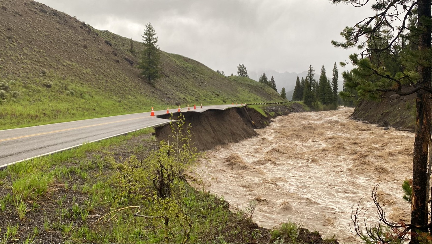 High water levels in the Lamar River erode Yellowstone National Park's Northeast Entrance Road