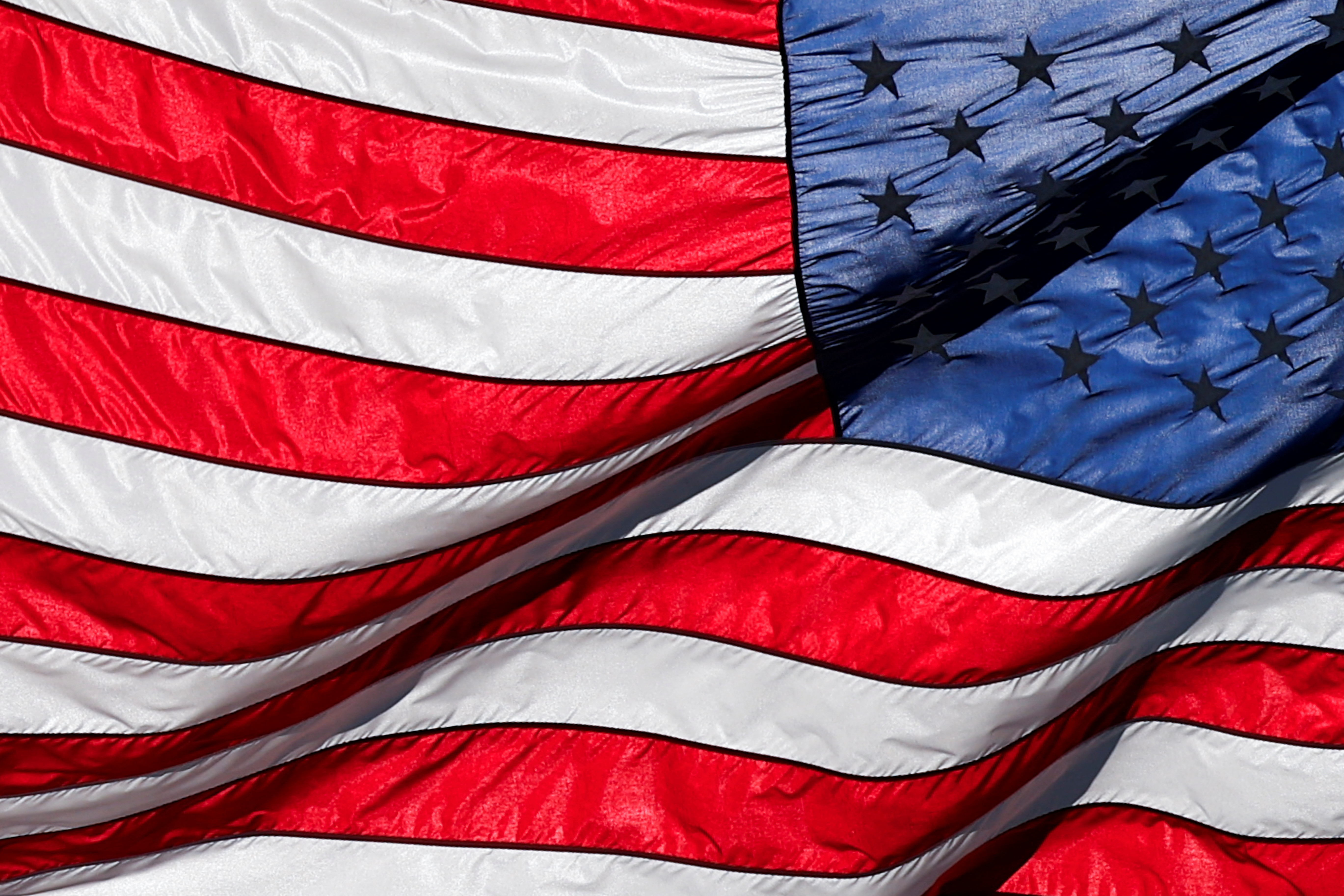 American Flag on the U.S. Capitol Building is seen in Washington