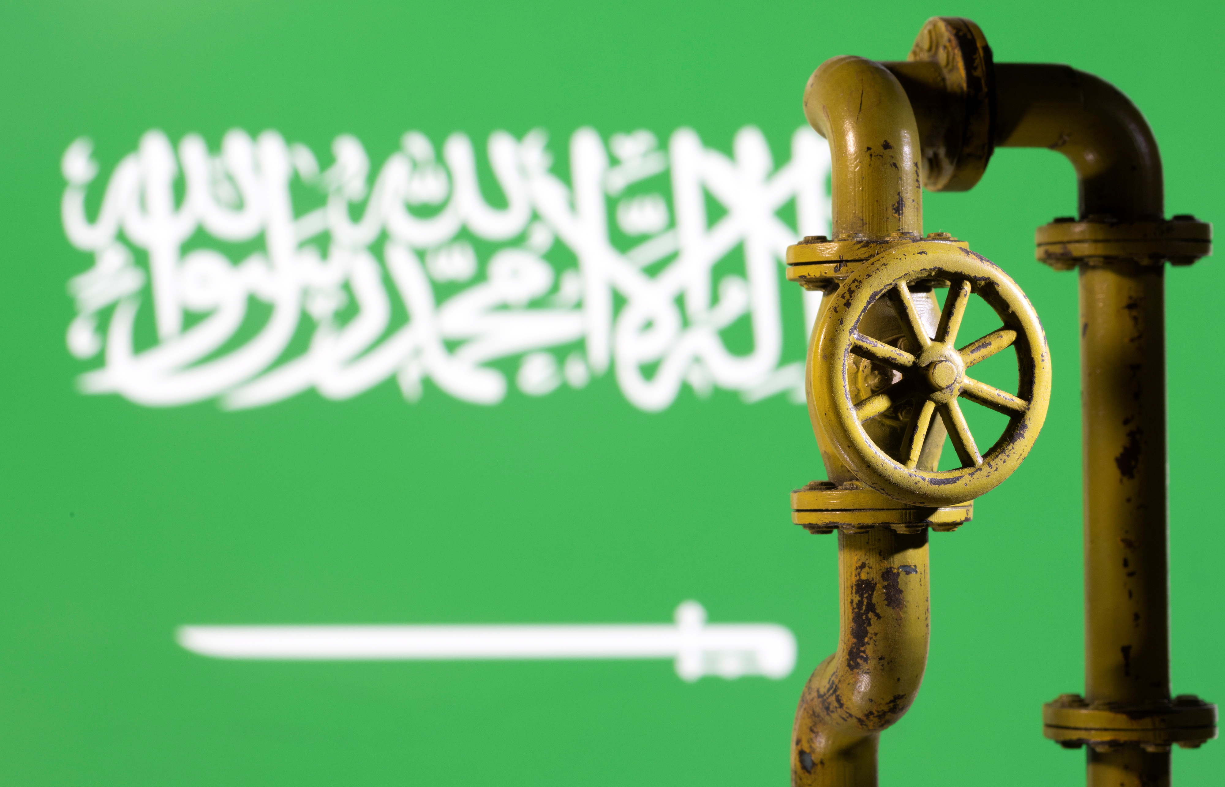 Illustration shows Saudi Arabian flag and natural gas pipeline