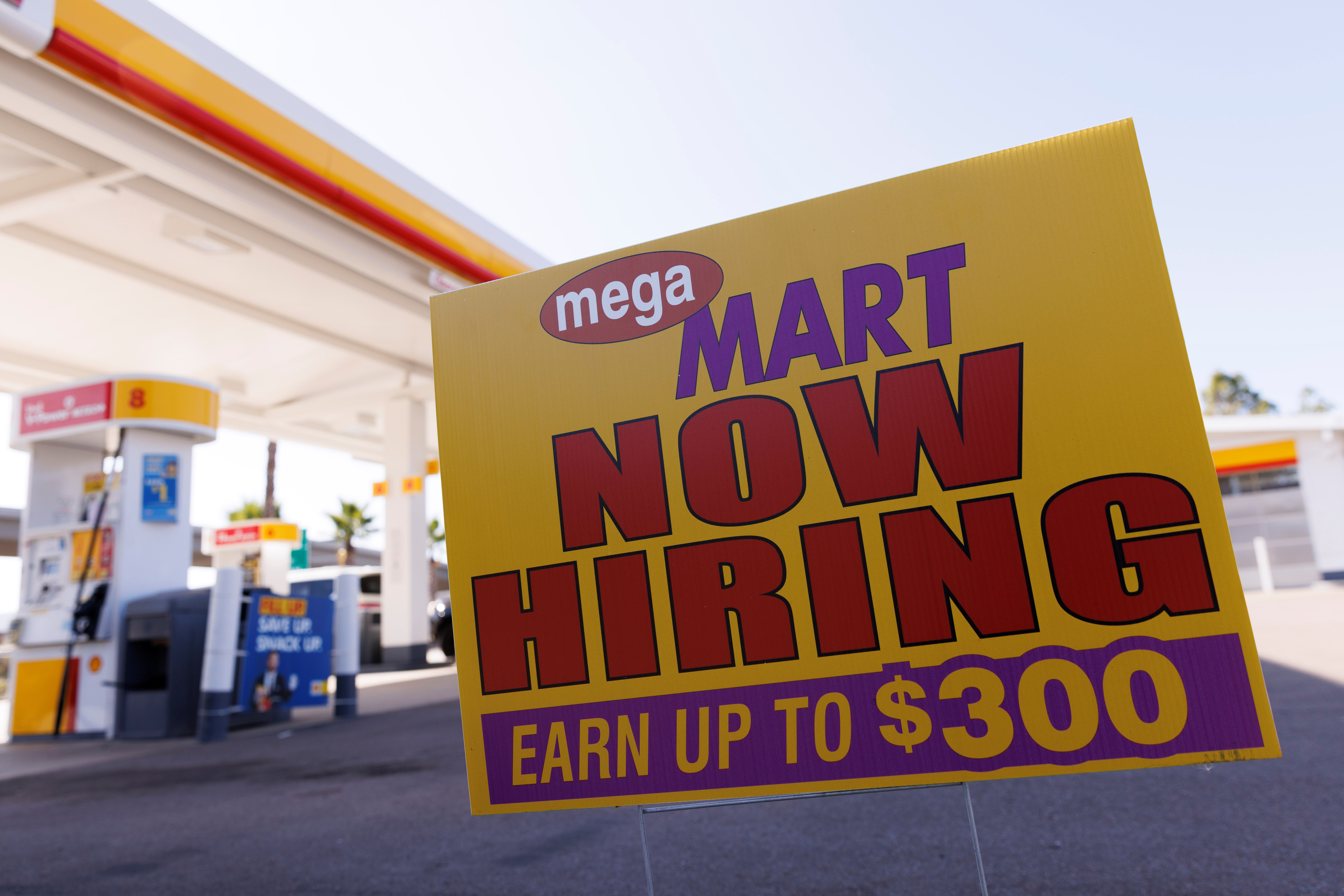 A job posting looking for workers is shown at a gas station in San Diego