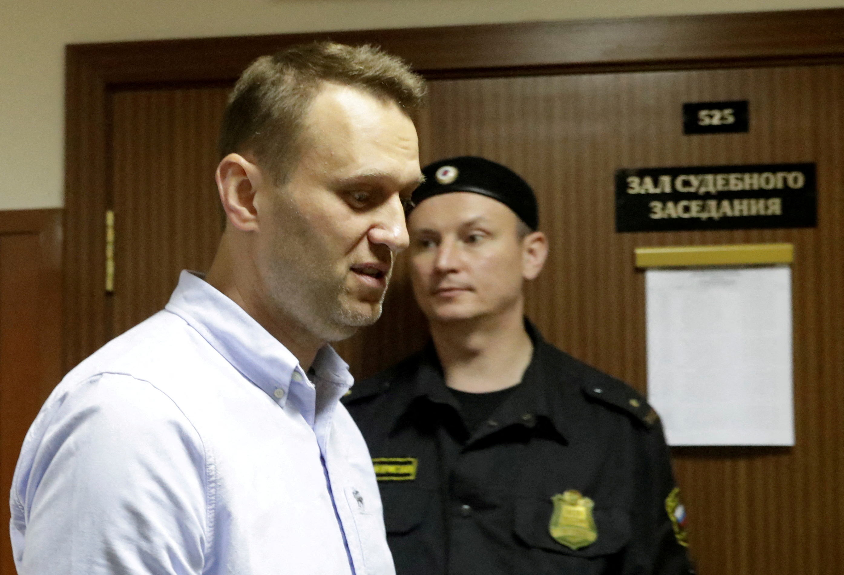 Russian opposition leader Alexei Navalny arrives for a hearing for his appeal at a court in Moscow