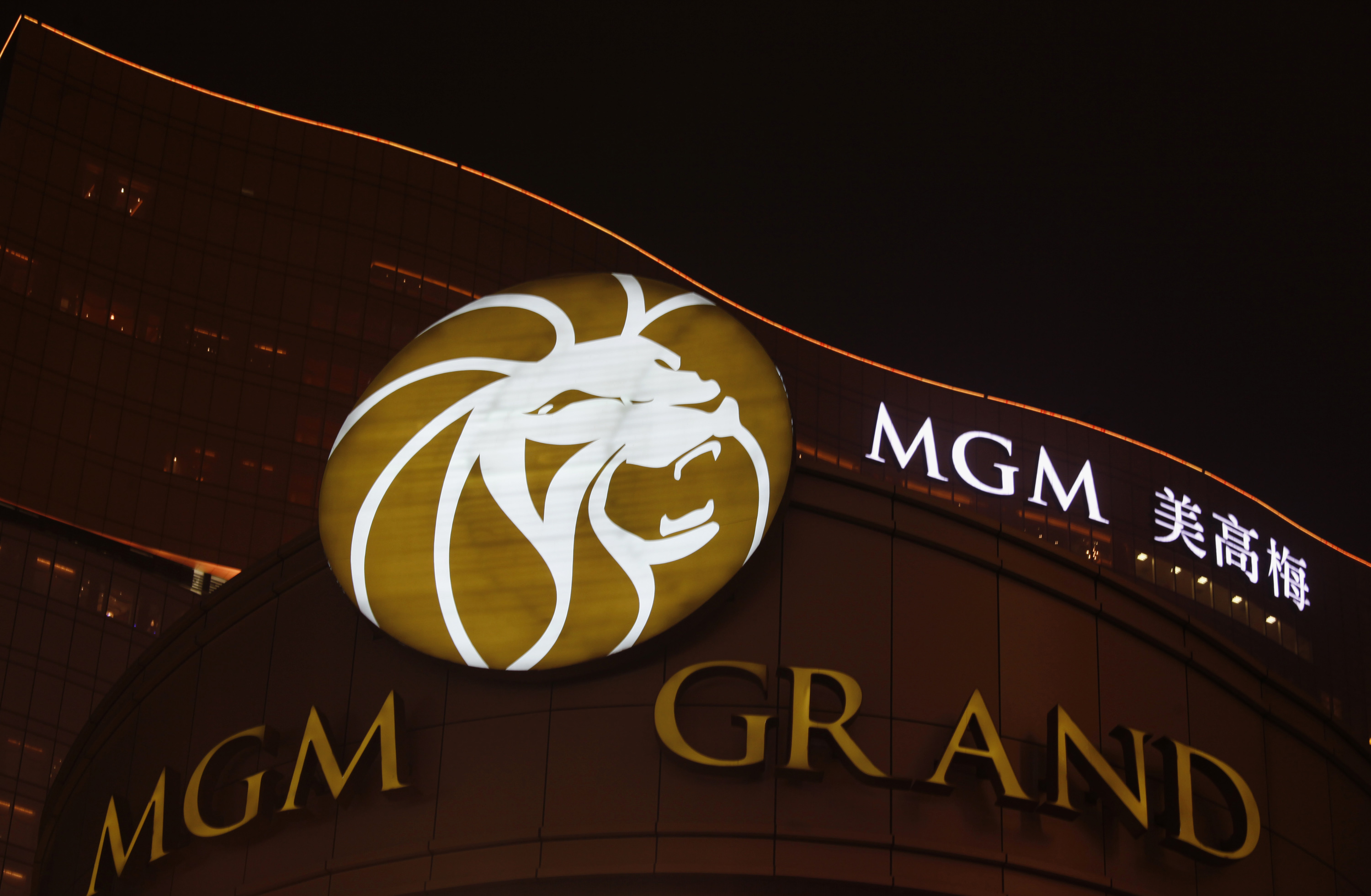 MGM Grand resort is lit up in the evening in Macau