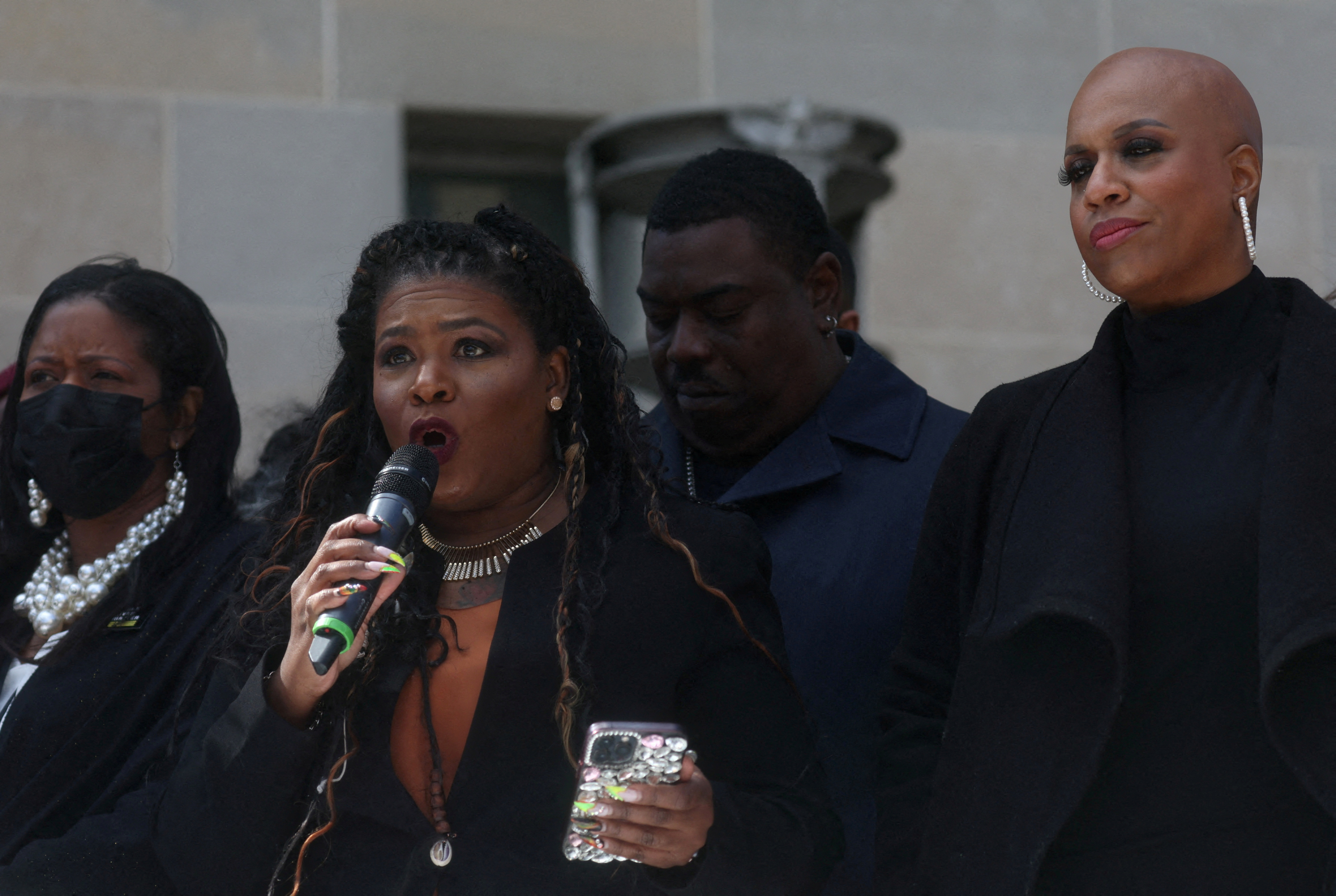 U.S. Rep. Cori Bush (D-MO) rallies with U.S. Rep. Ayanna Pressley (D-MA) outside of the U.S. Department of Justice to call for an end to qualified immunity in Washington, U.S., March 3, 2022. REUTERS/Leah Millis
