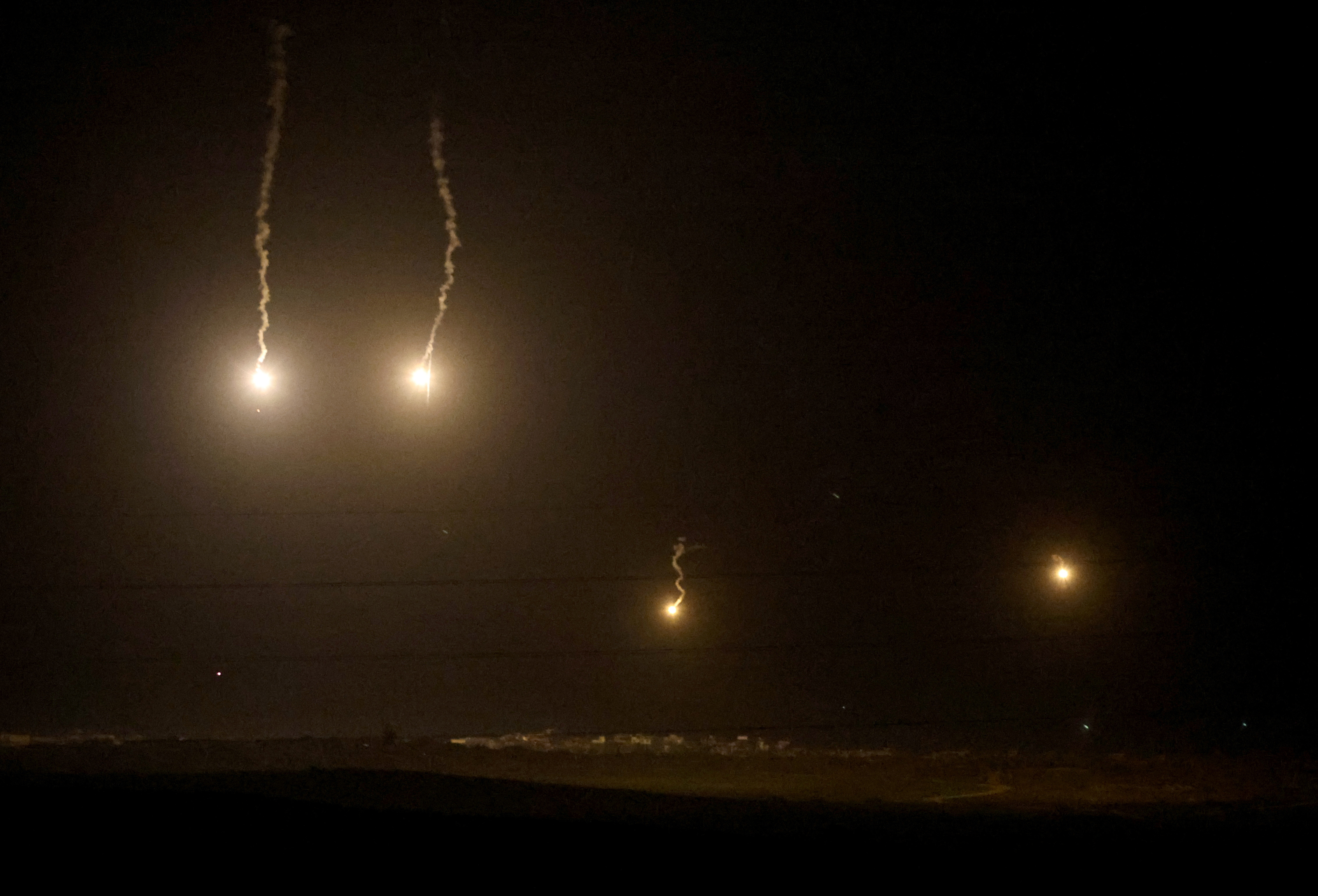 Flares fall over Gaza, as seen from Sderot