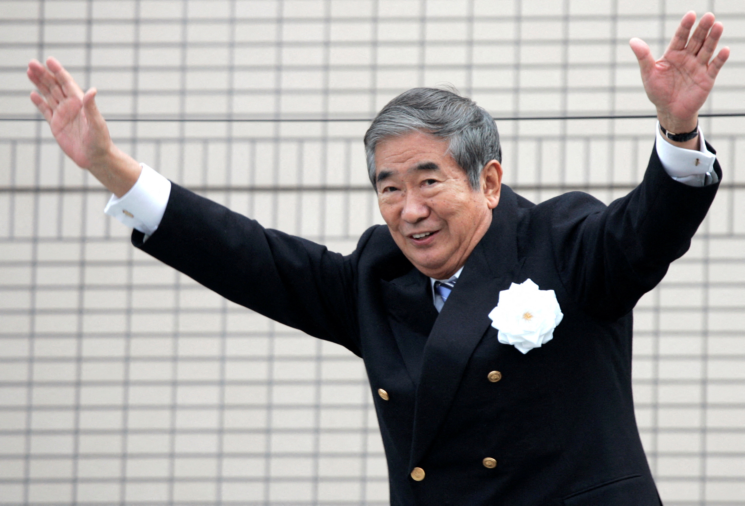 Tokyo Governor Ishihara waves to voters during his stumping tour for the Tokyo gubernatorial election in Tokyo