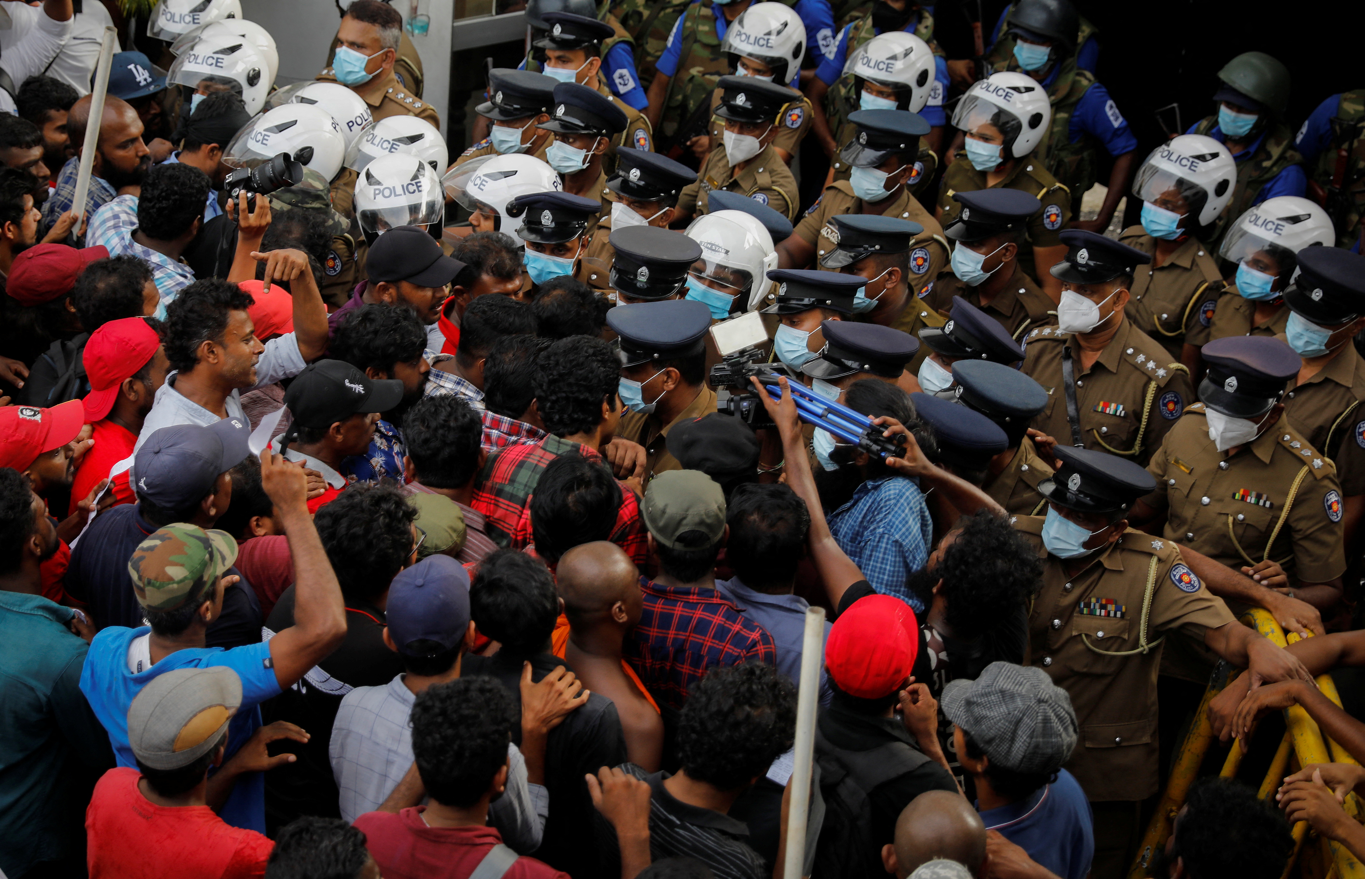 Anti-government demonstrators protest in front of police headquarters in Colombo