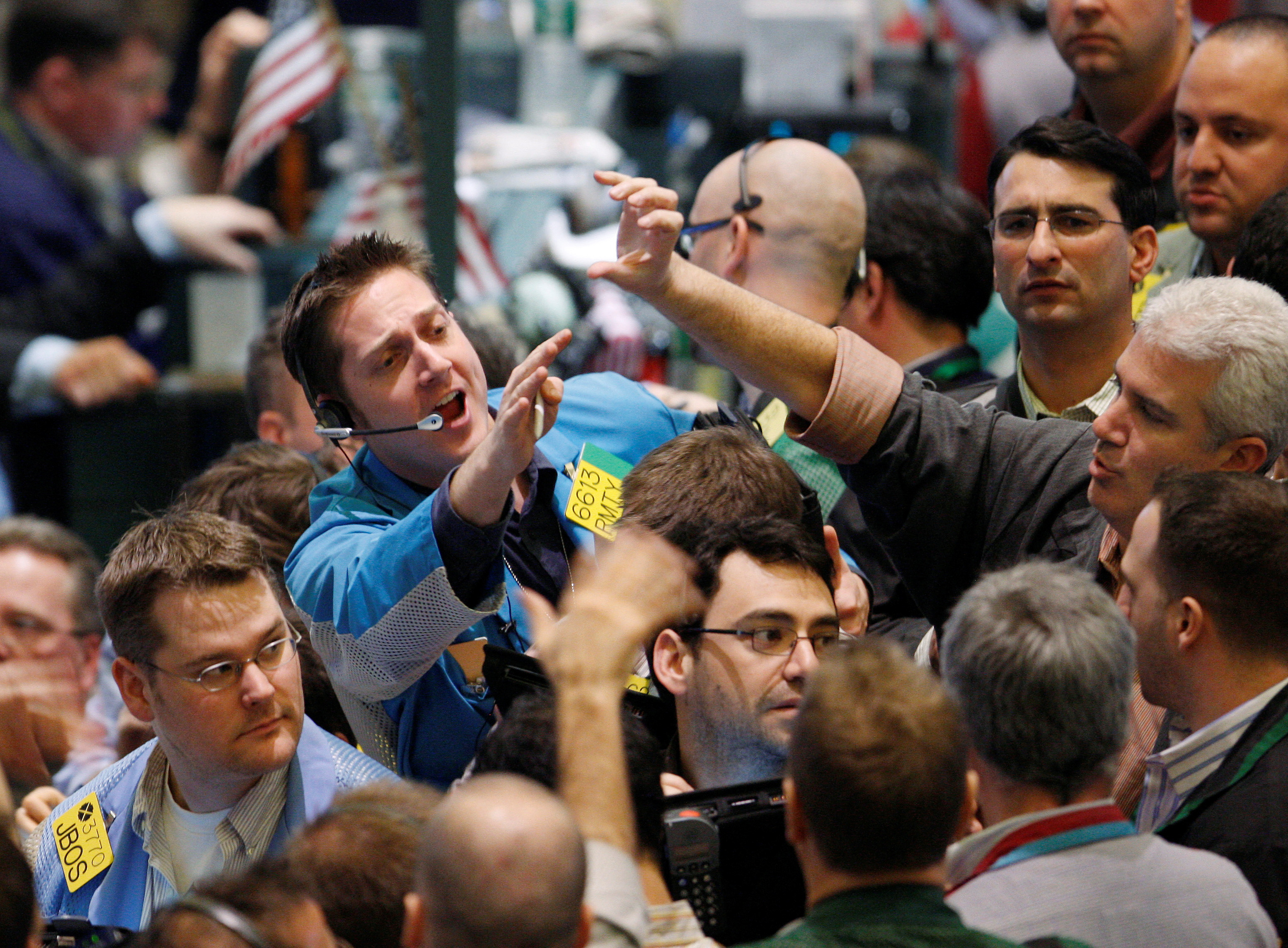 Traders work in the oil options pit of the New York Mercantile Exchange