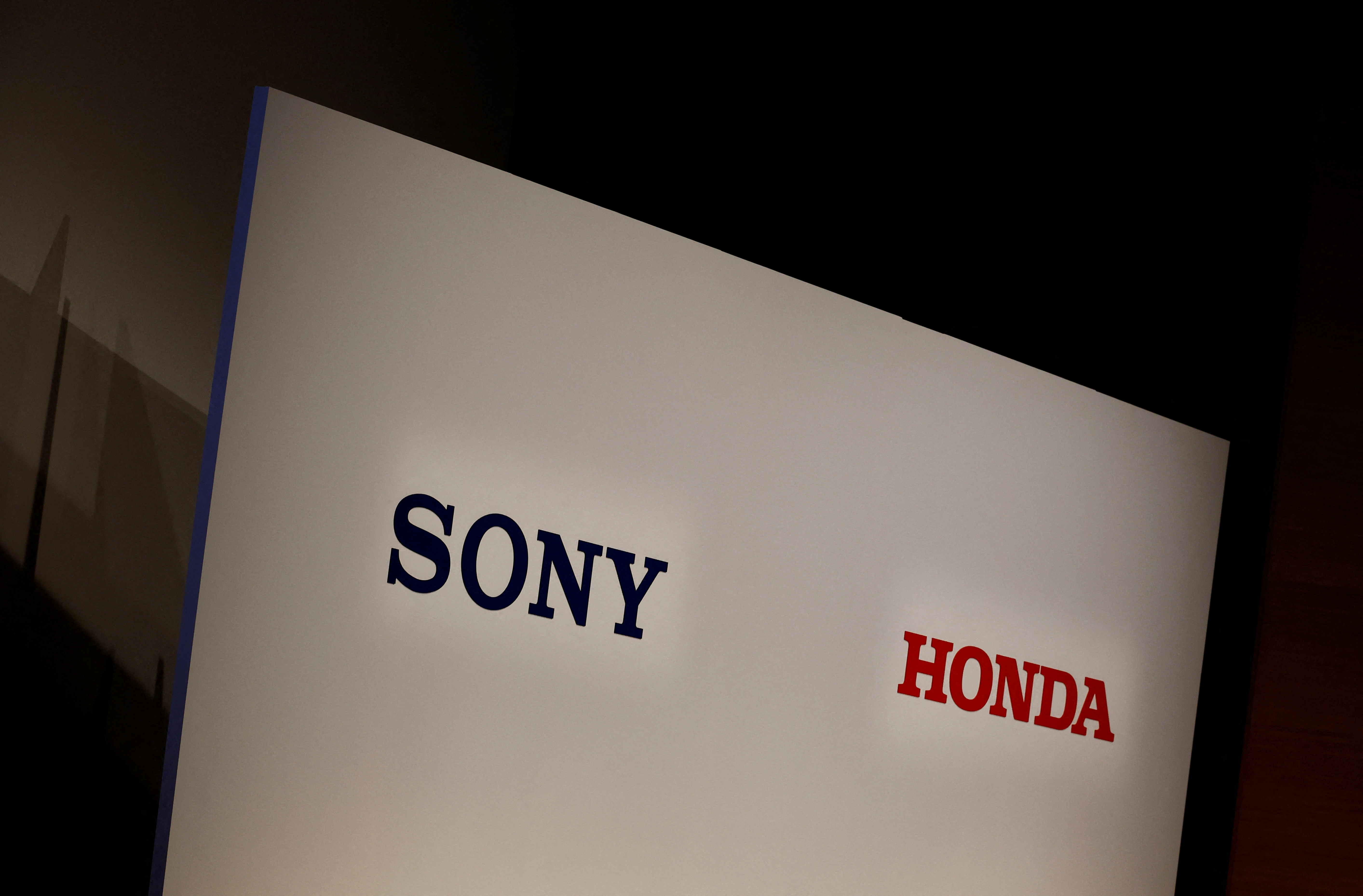 Sony Corp's and Honda Motor's logos are pictured at their joint news conference venue in Tokyo