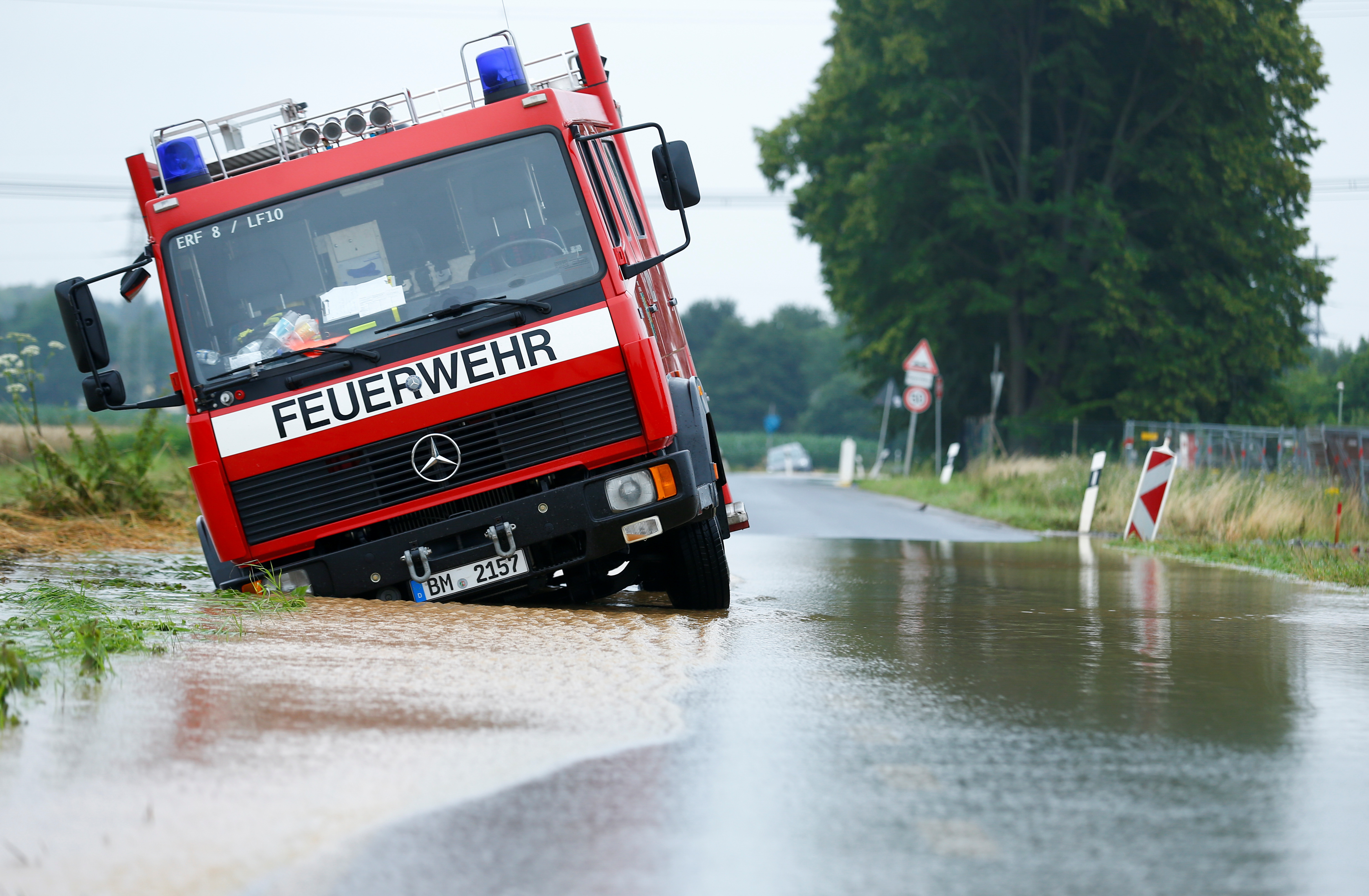 A fire truck is stuck on a flooded street following heavy rainfalls in Erftstadt, Germany, July 16, 2021. REUTERS/Thilo Schmuelgen