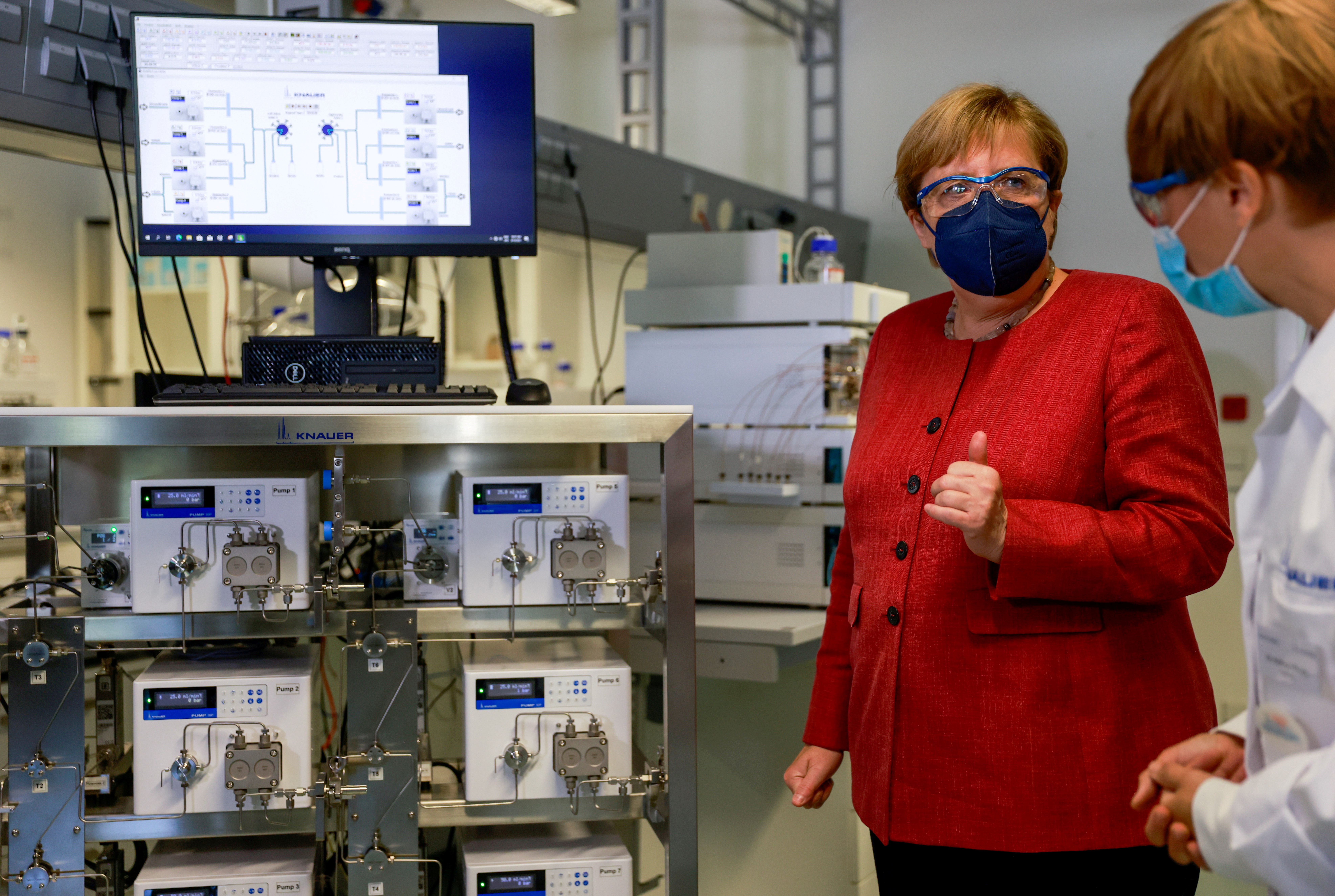 German Chancellor Angela Merkel visits laboratory measuring device producer Knauer in Berlin, Germany