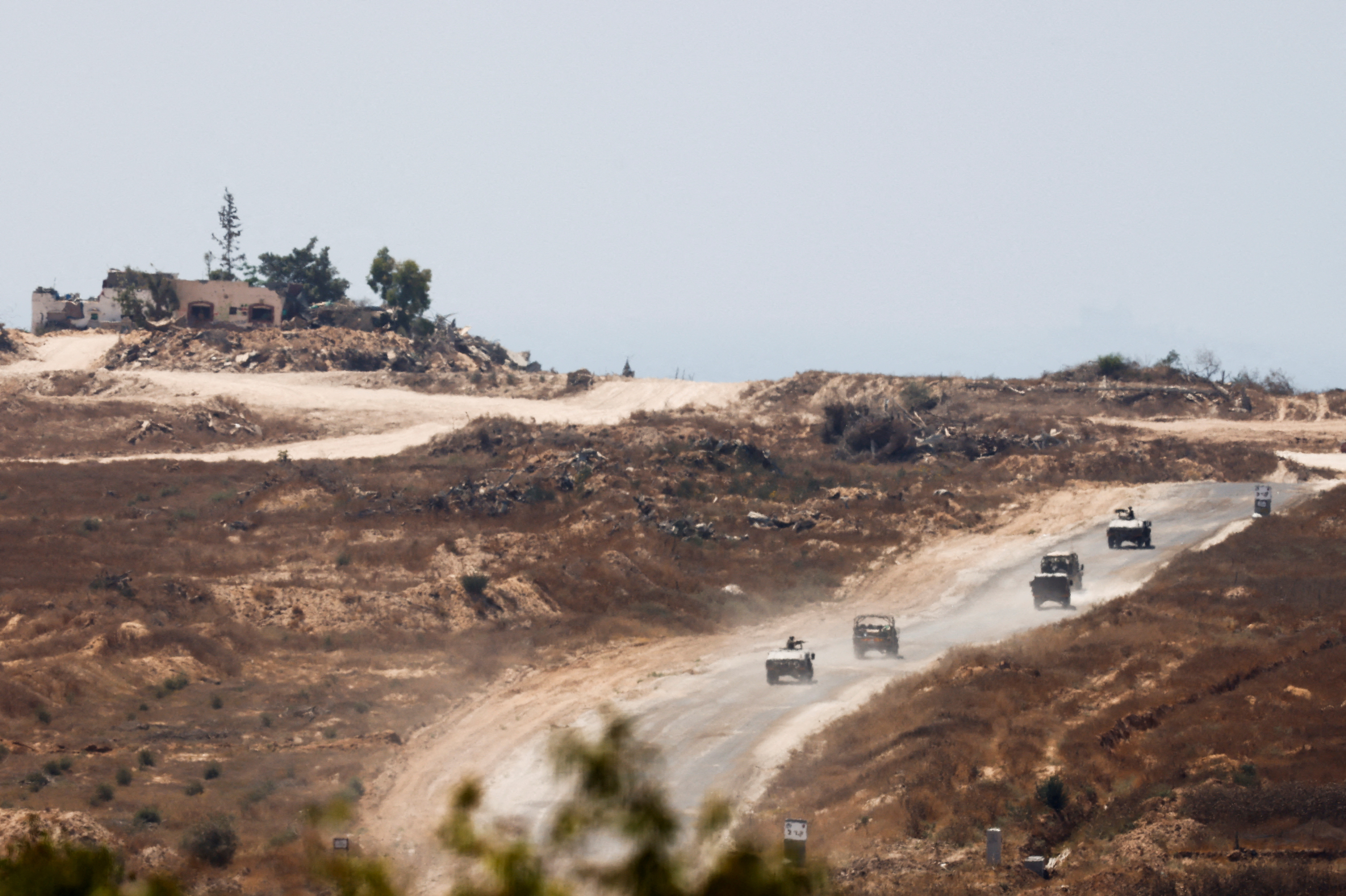 Israeli military vehicles maneuver inside the Gaza Strip