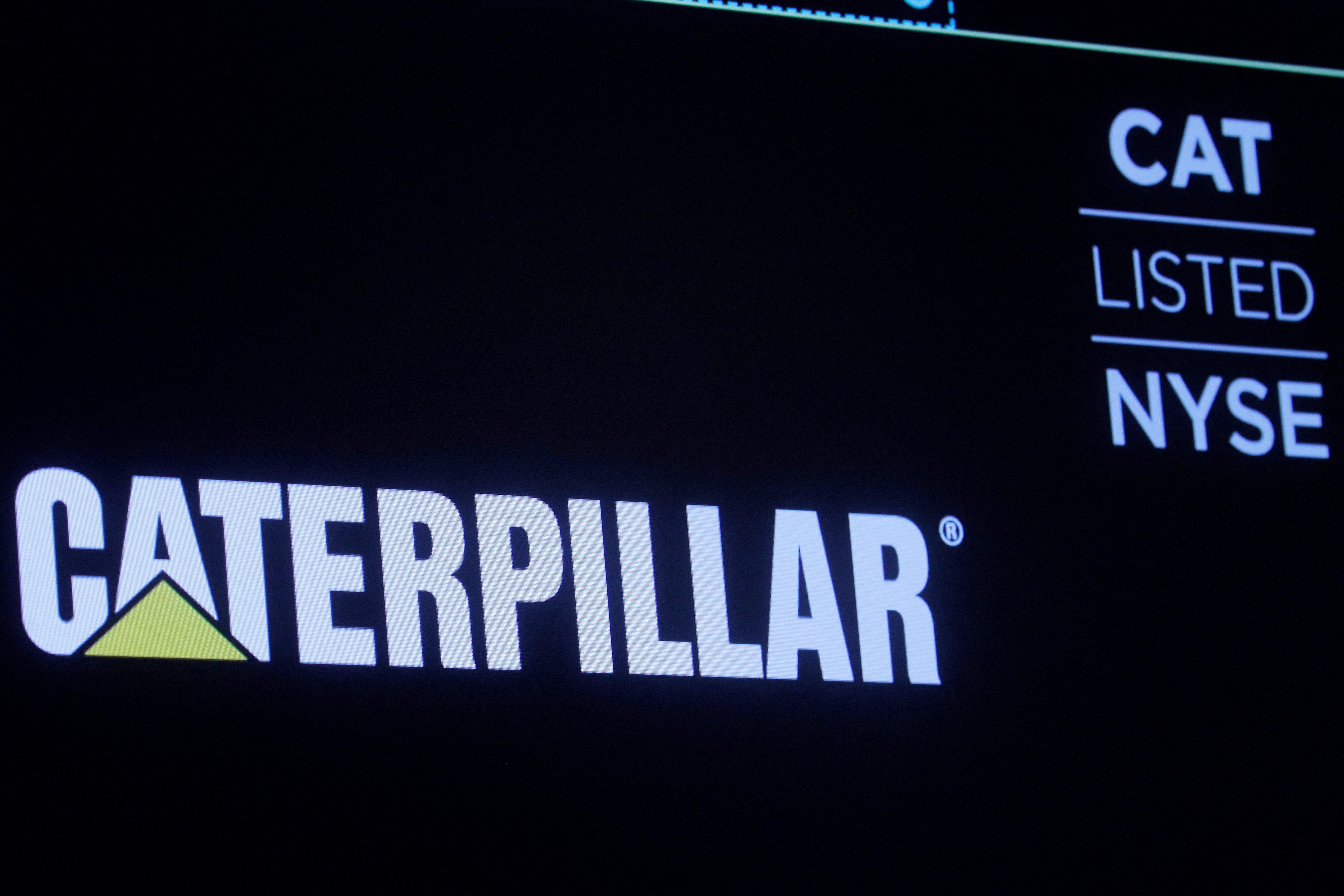 The company logo for Caterpillar Inc. is displayed on a screen at the NYSE in New York
