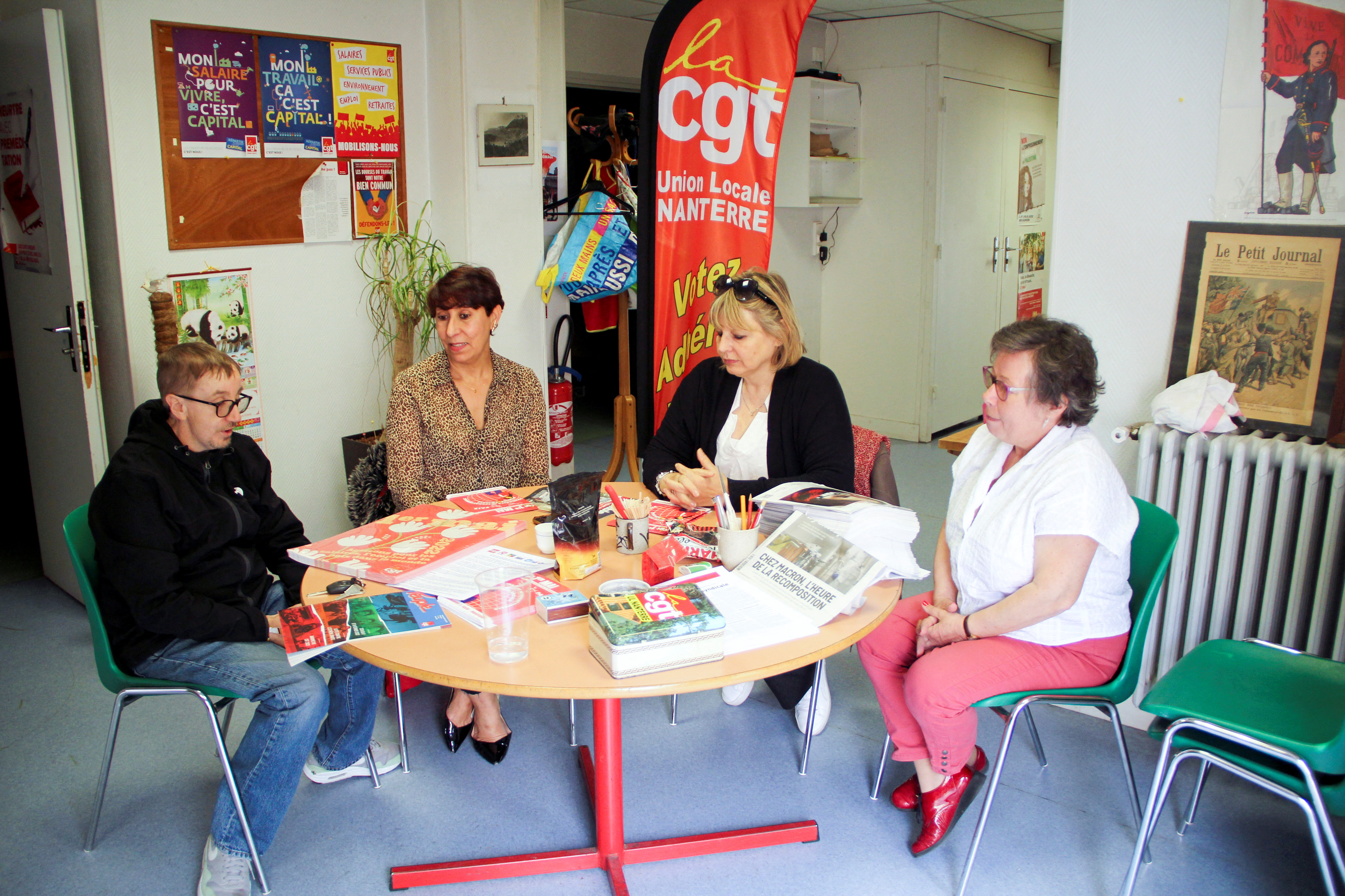 French CGT labour union members prepare the Labour Day protest at their local office in Nanterre