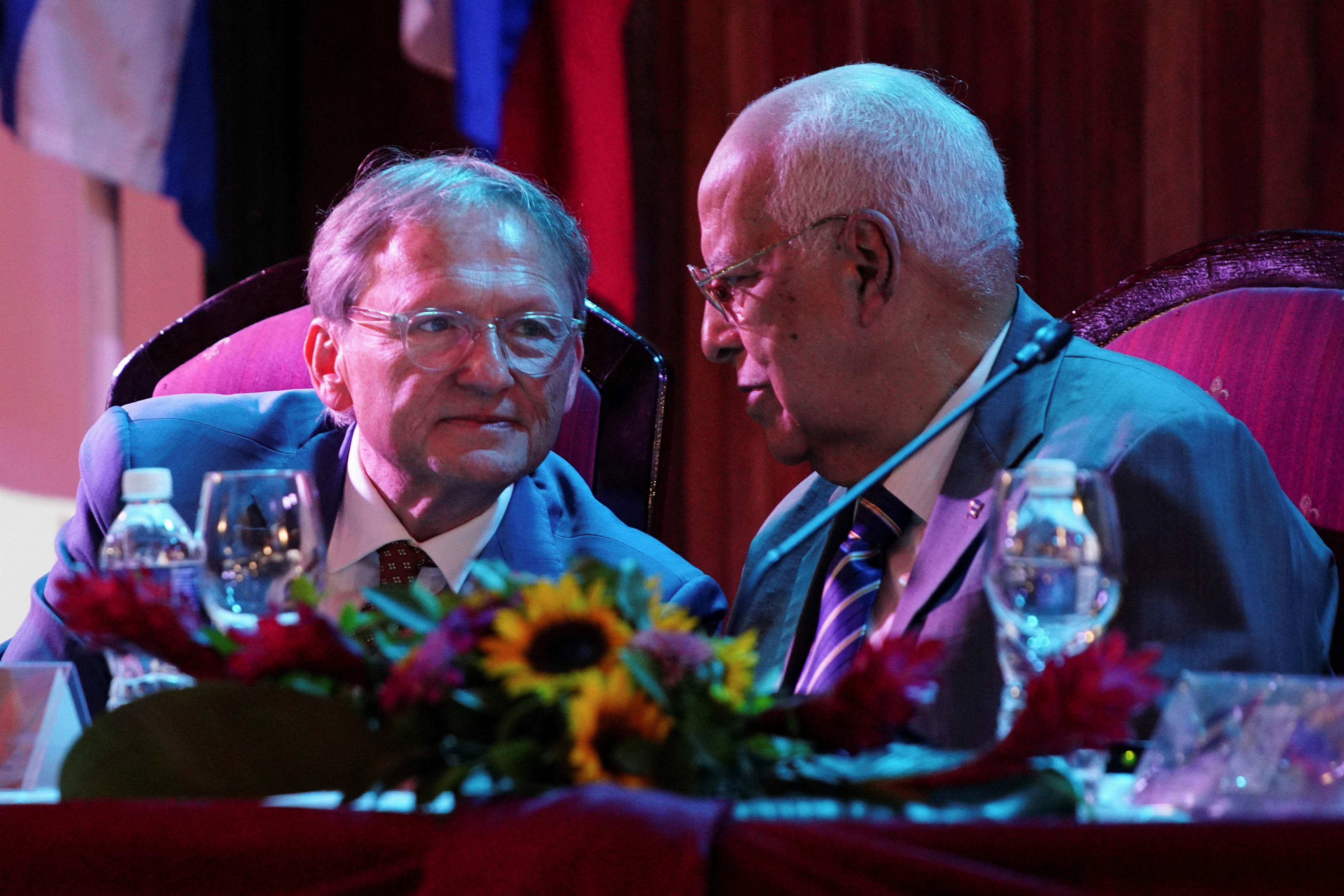 Boris Titov, head of the Russian delegation of the Cuban-Russian Business Committee speaks with Cuba's Foreign Trade and Investment Minister Ricardo Cabrisas in Havana