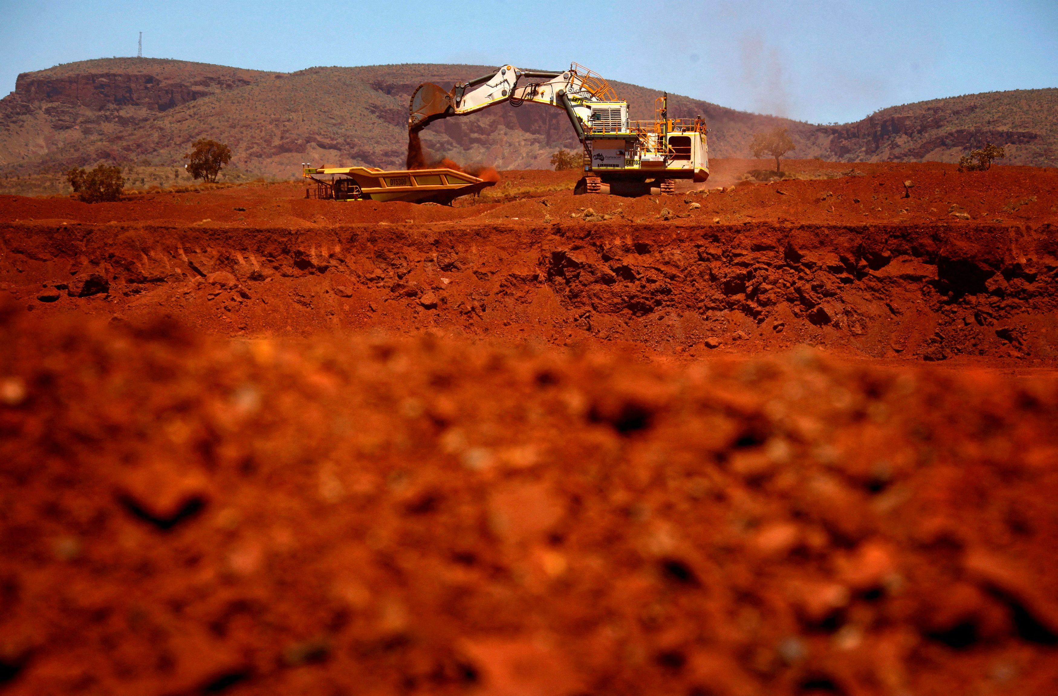 File picture of a giant excavator loading a mining truck at the Fortescue Solomon iron ore mine south of Port Hedland