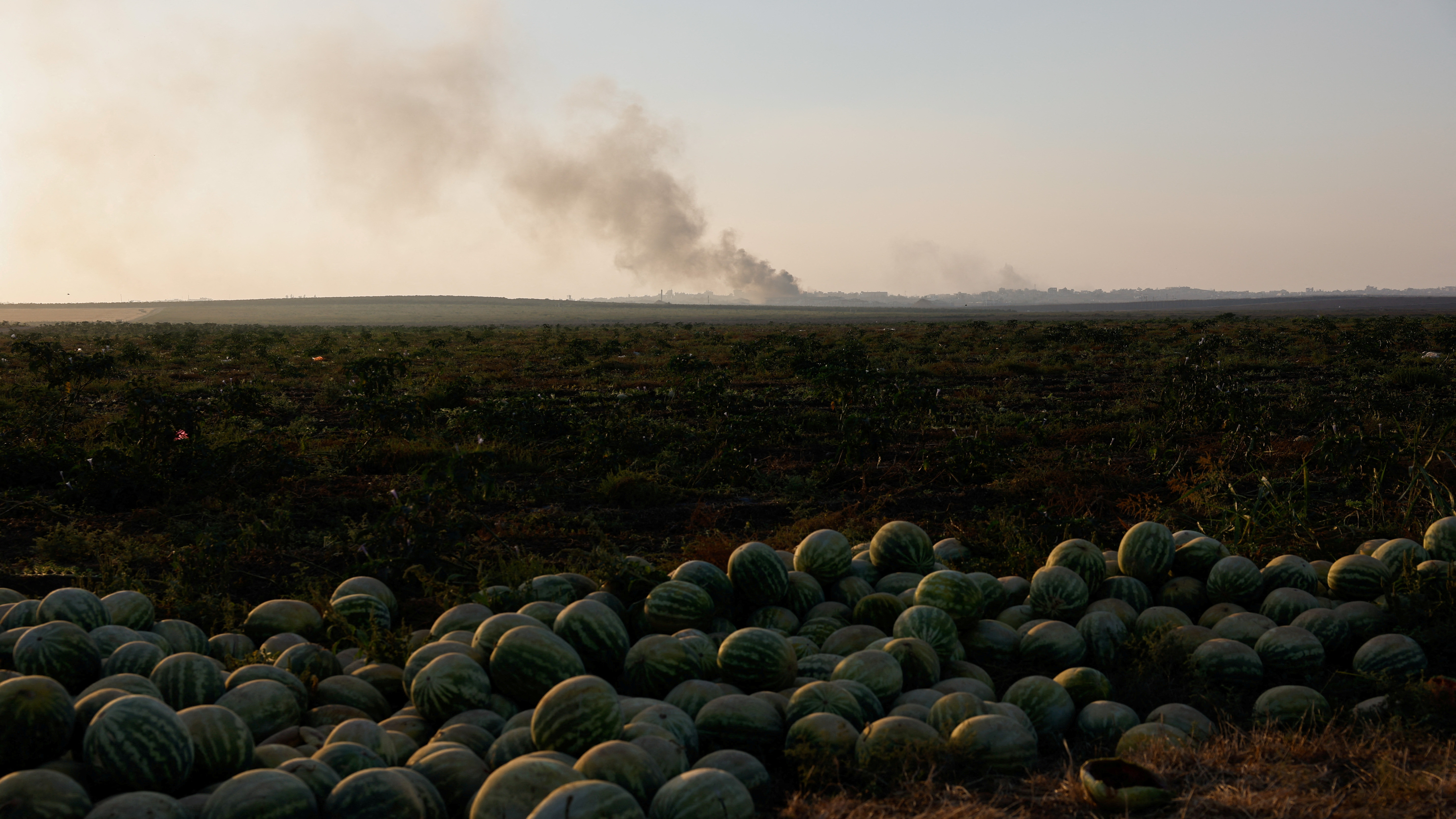 Israeli soldiers fire a mortar, amid the Israel-Hamas conflict, near the Israel-Gaza border