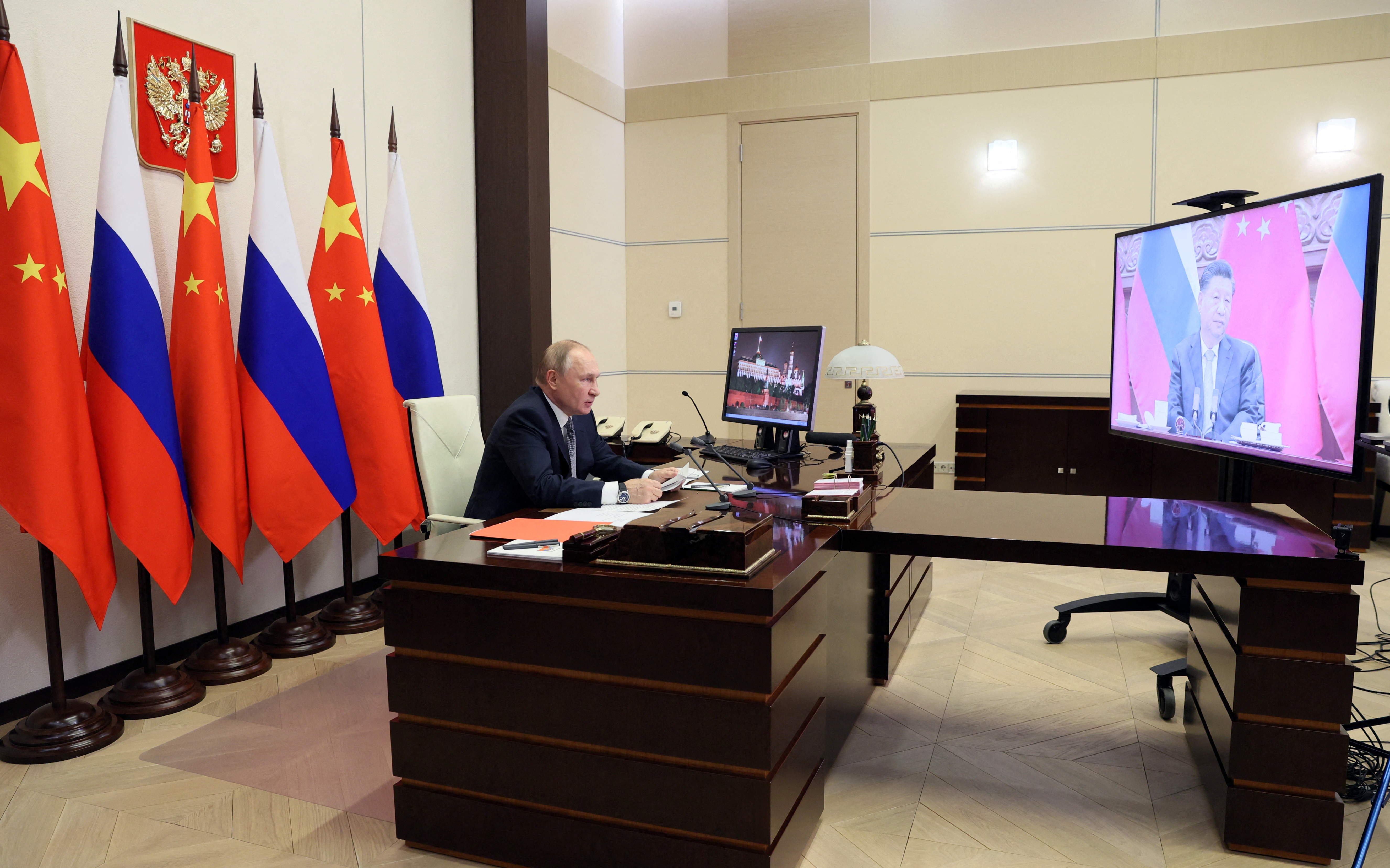 Russian President Vladimir Putin holds talks with Chinese President Xi Jinping via a video link at his residence outside Moscow, Russia December 15, 2021. Sputnik/Mikhail Metzel/Pool via REUTERS 