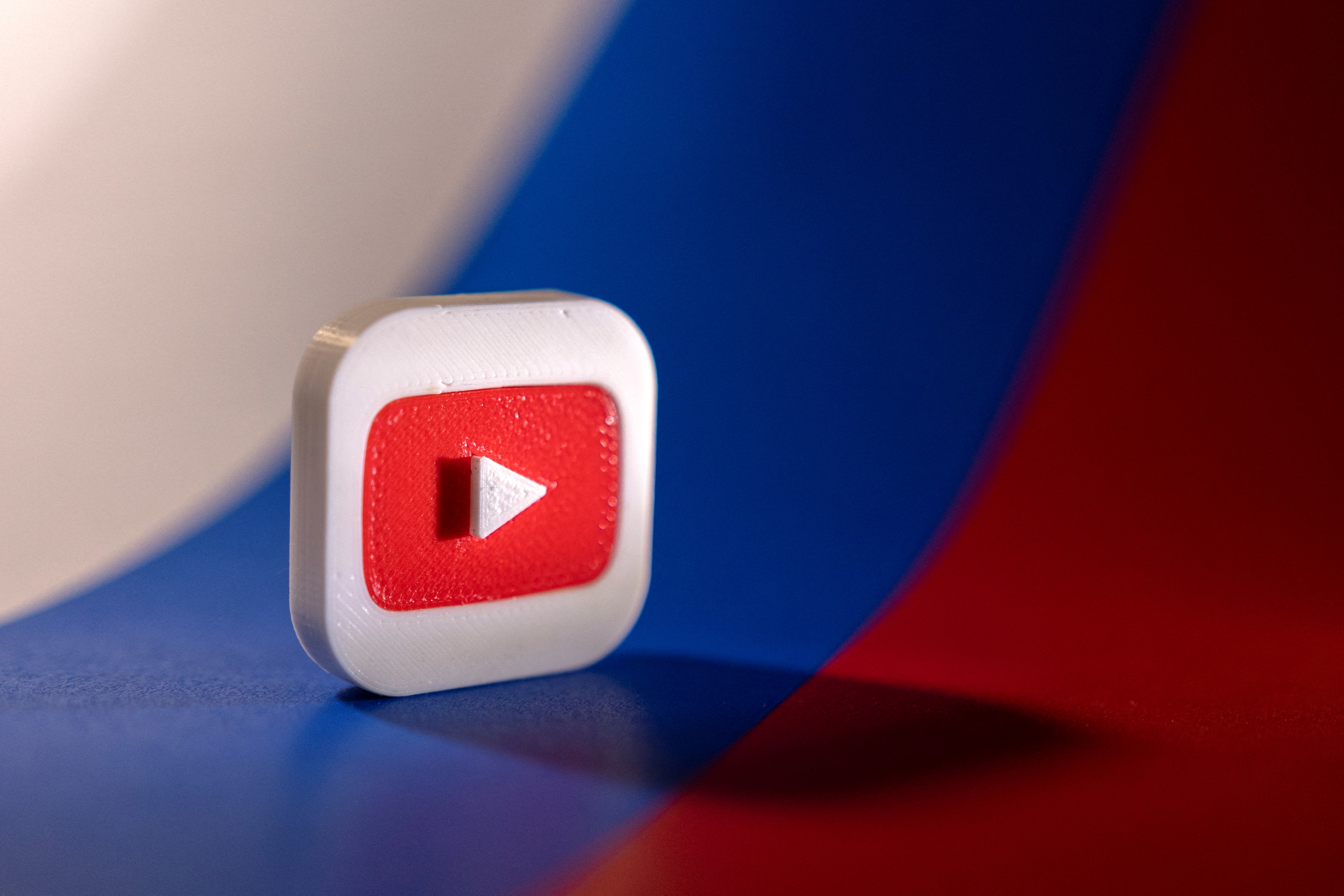 Illustration shows Youtube logo and Russian flag