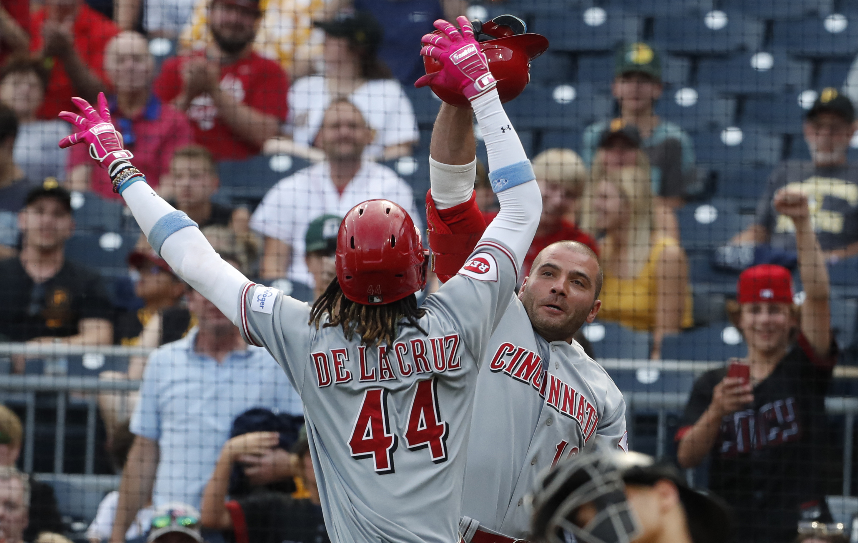 Cruz HR, drives in lead run, Pirates top Reds on opening day