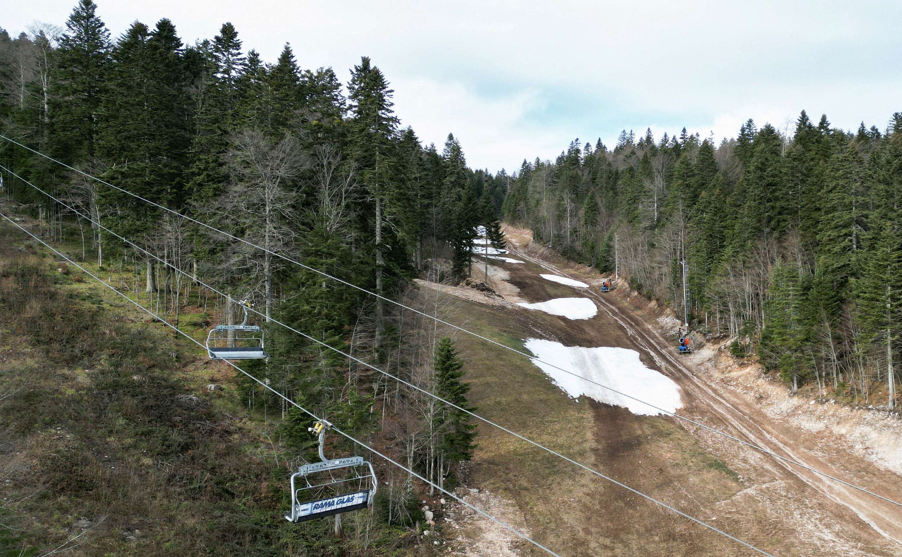 Melting snow on a ski slope at a ski center in Bjelasnica