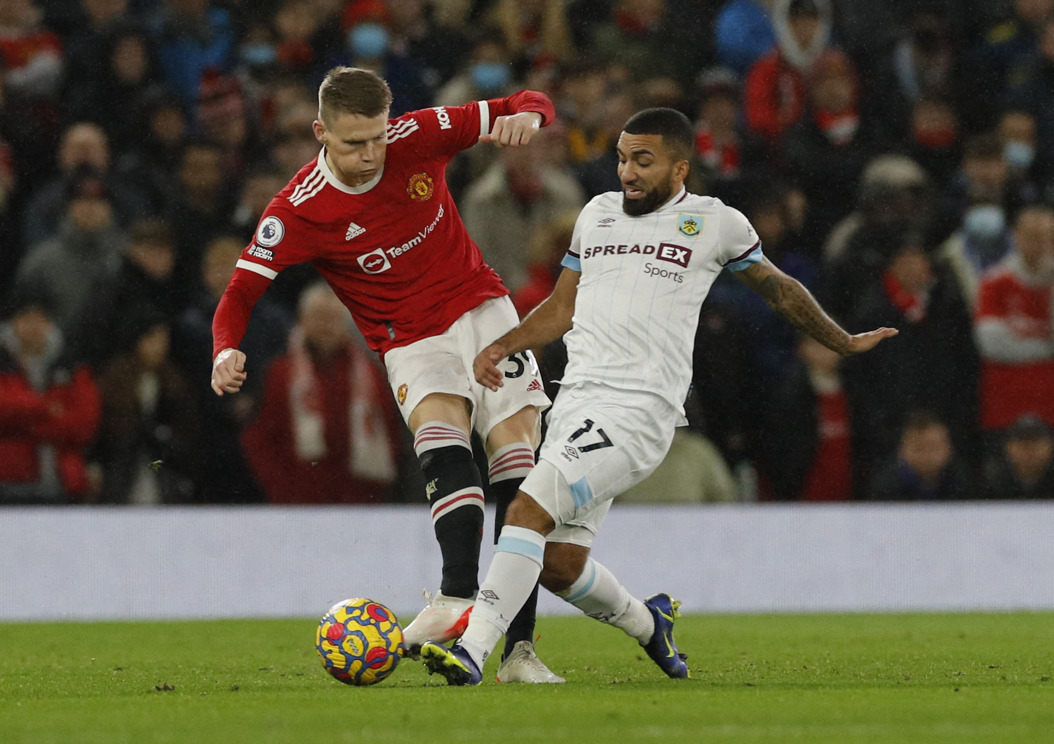 Soccer Football - Premier League - Manchester United v Burnley - Old Trafford, Manchester, Britain - December 30, 2021 Manchester United's Scott McTominay in action with Burnley's Aaron Lennon REUTERS/Phil Noble 