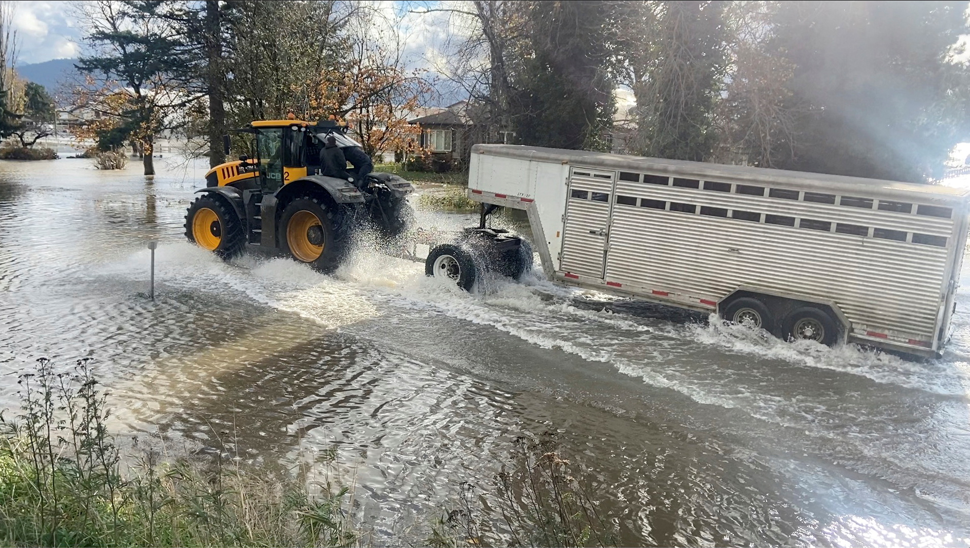 Farmers travel across flood waters to rescue their livestock in Abbotsford, British Columbia, Canada, November 16, 2021, in this still image from video obtained via social media. Video taken November 16, 2021. Derrek Pryor via REUTERS  