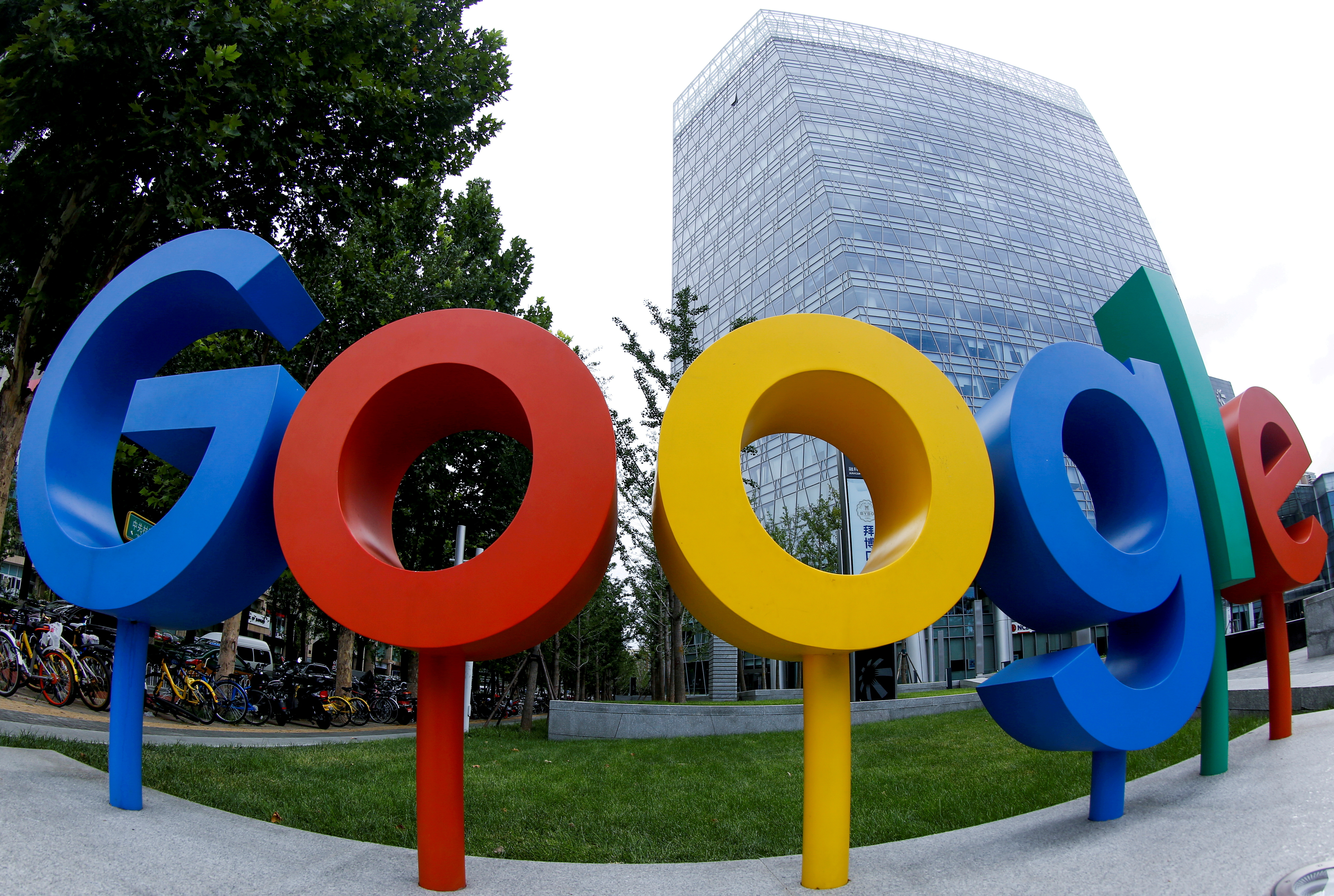 The brand logo of Alphabet Inc's Google is seen outside its office in Beijing, China, August 8, 2018.  Picture taken with a fisheye lens. REUTERS/Thomas Peter/File Photo/File Photo