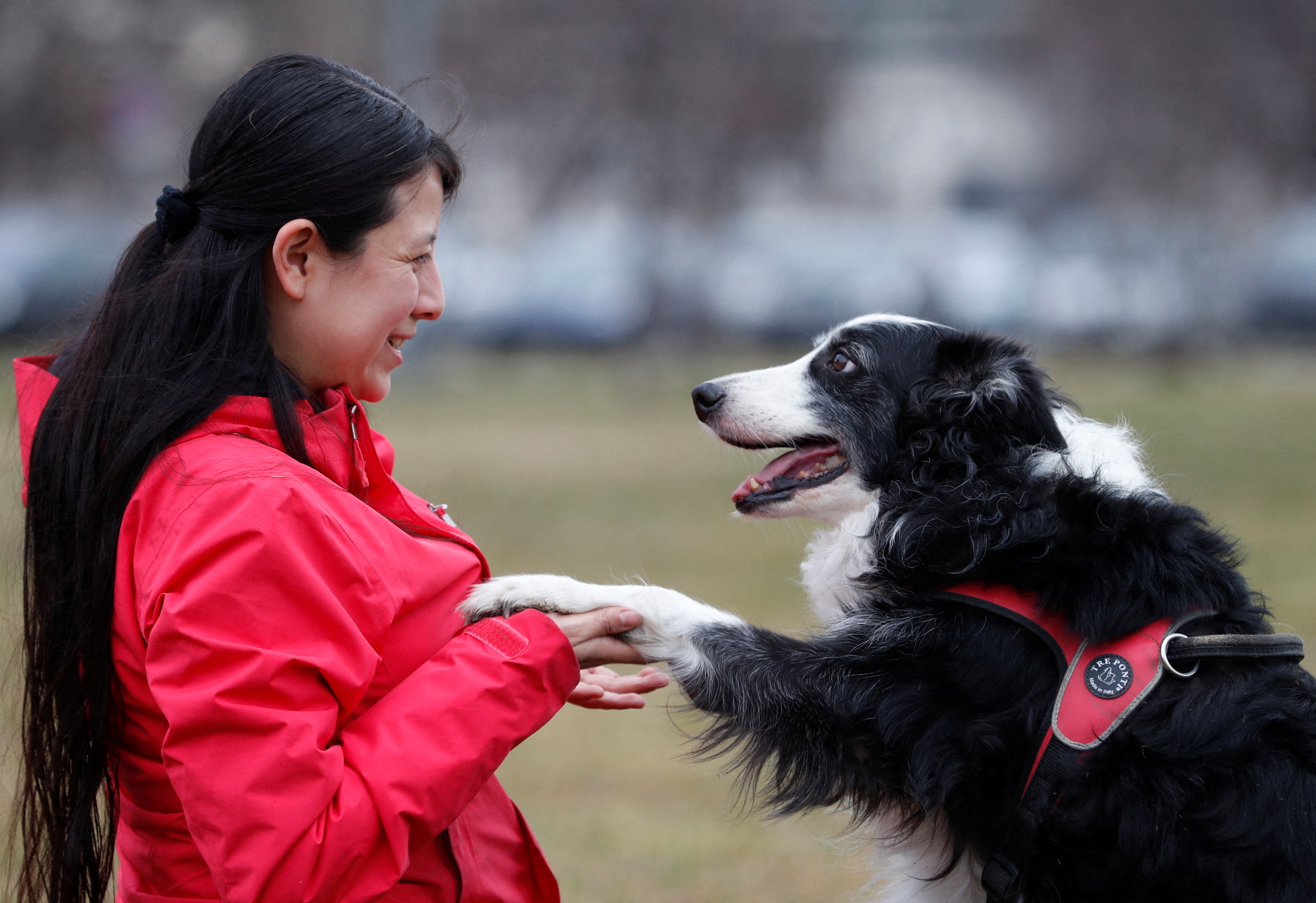 Postdoctoral researcher Laura V. Cuaya talks to her dog Kun-kun, an 8-year-old Border Collie, at the Ethology Department of the Eotvos Lorand University in Budapest, Hungary, January 5, 2022. REUTERS/Bernadett Szabo