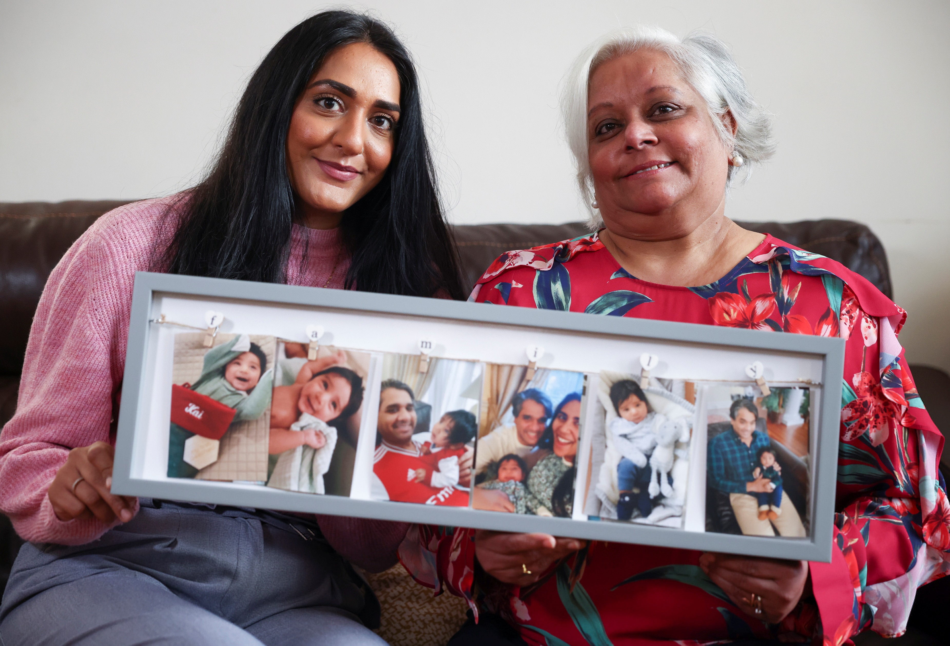 Bhavna Patel and her daughter Bindiya Patel, who are due to fly to New York to reunite with family following the relaxing of the coronavirus disease (COVID-19) travel restrictions, pose at their home in Croydon, Britain, November 5, 2021. REUTERS/Henry Nicholls