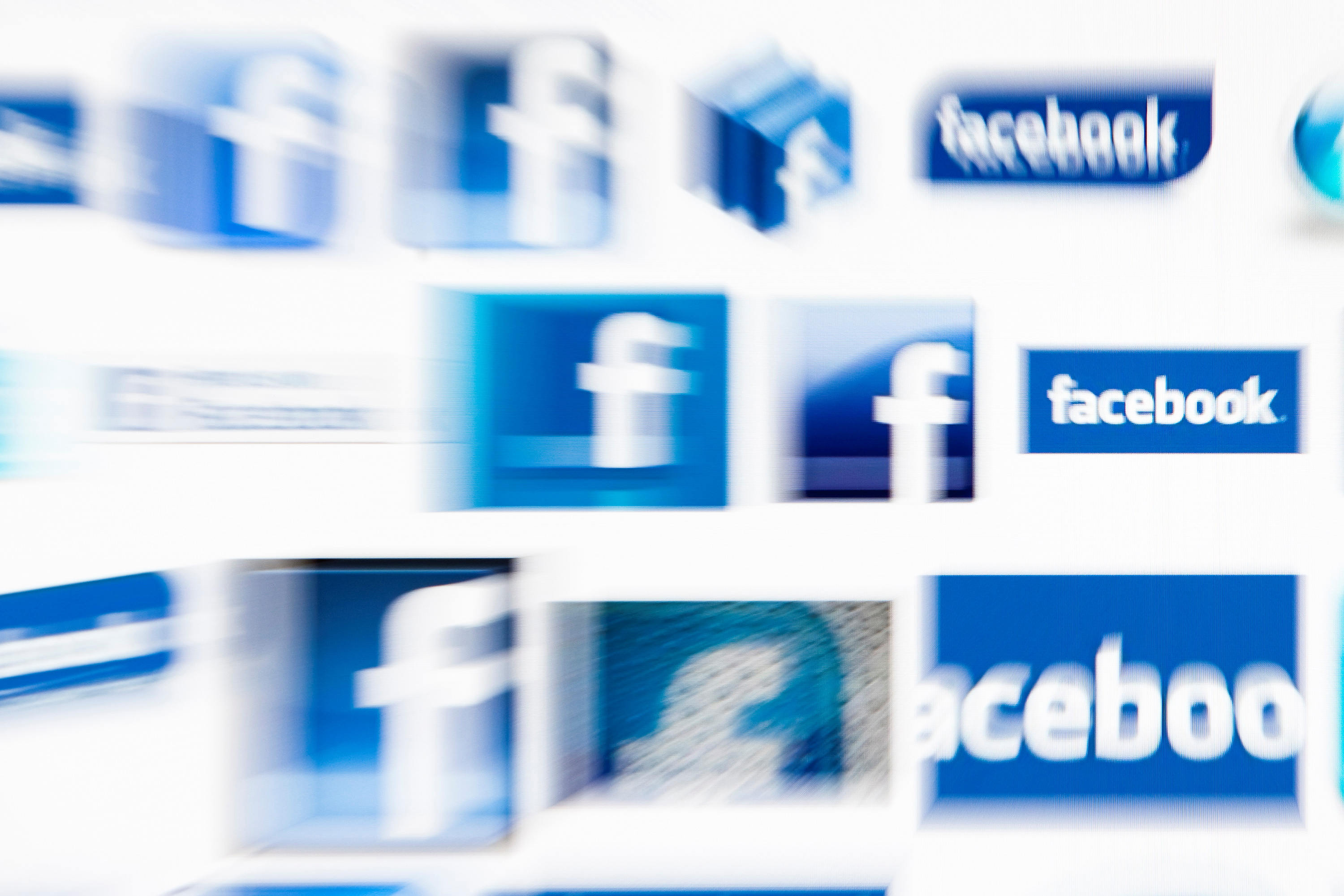 Facebook logos on a computer screen are seen in this photo illustration taken in Lavigny