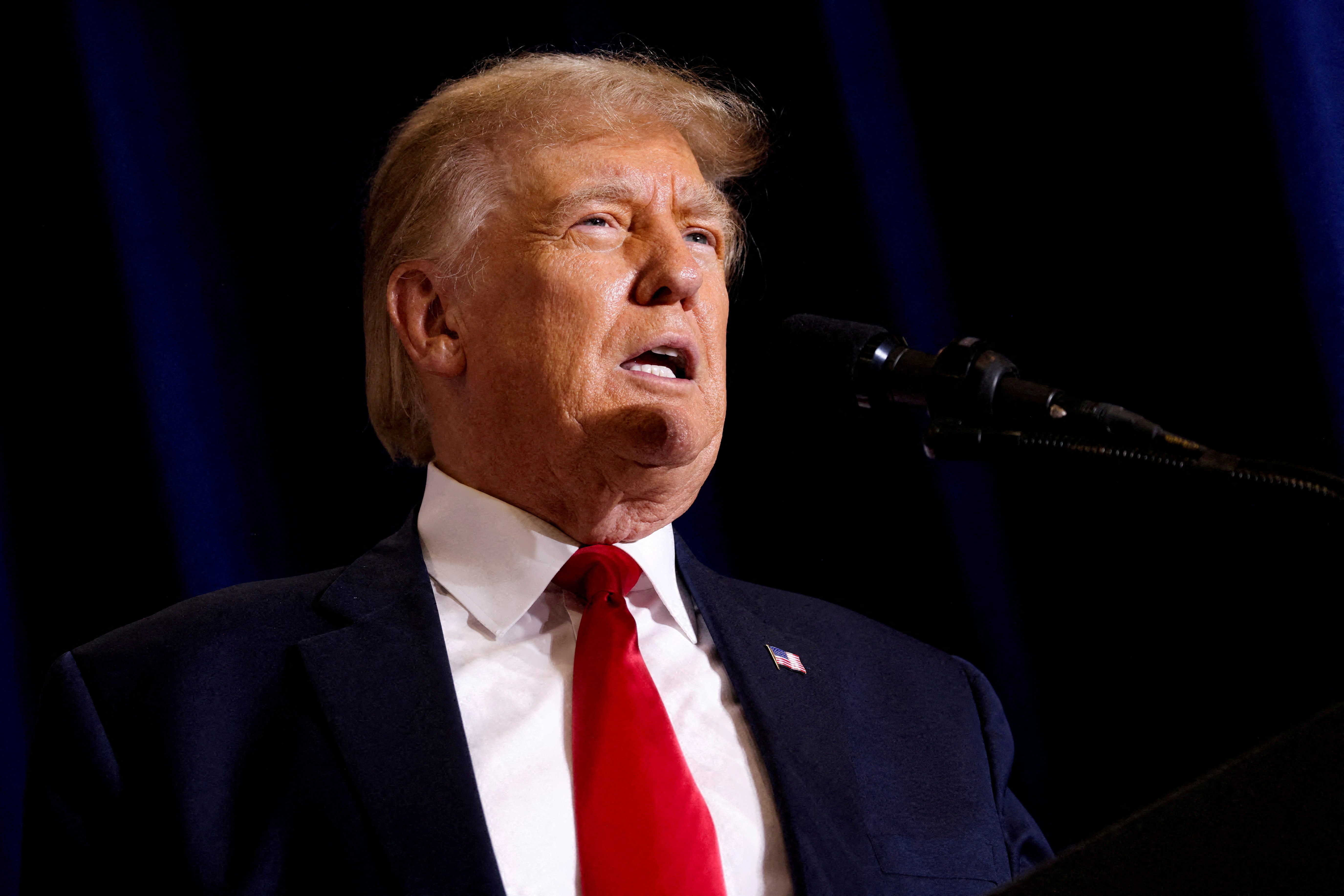 Former US President and Republican presidential candidate Donald Trump speaks at a 2024 presidential campaign rally in Dubuque.