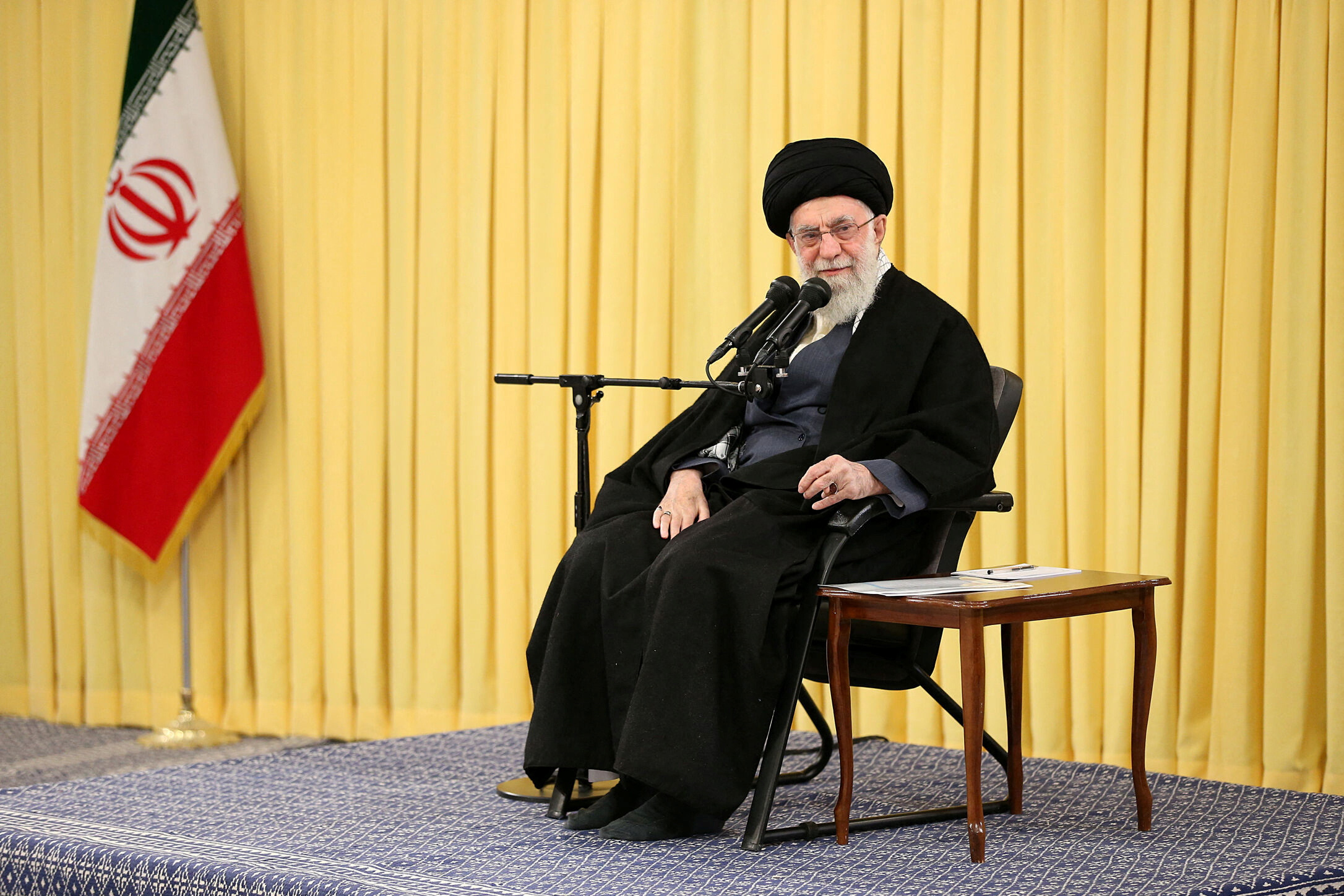 Iran's Supreme Leader Ayatollah Ali Khamenei prays during a meeting with a group of girls in Tehran