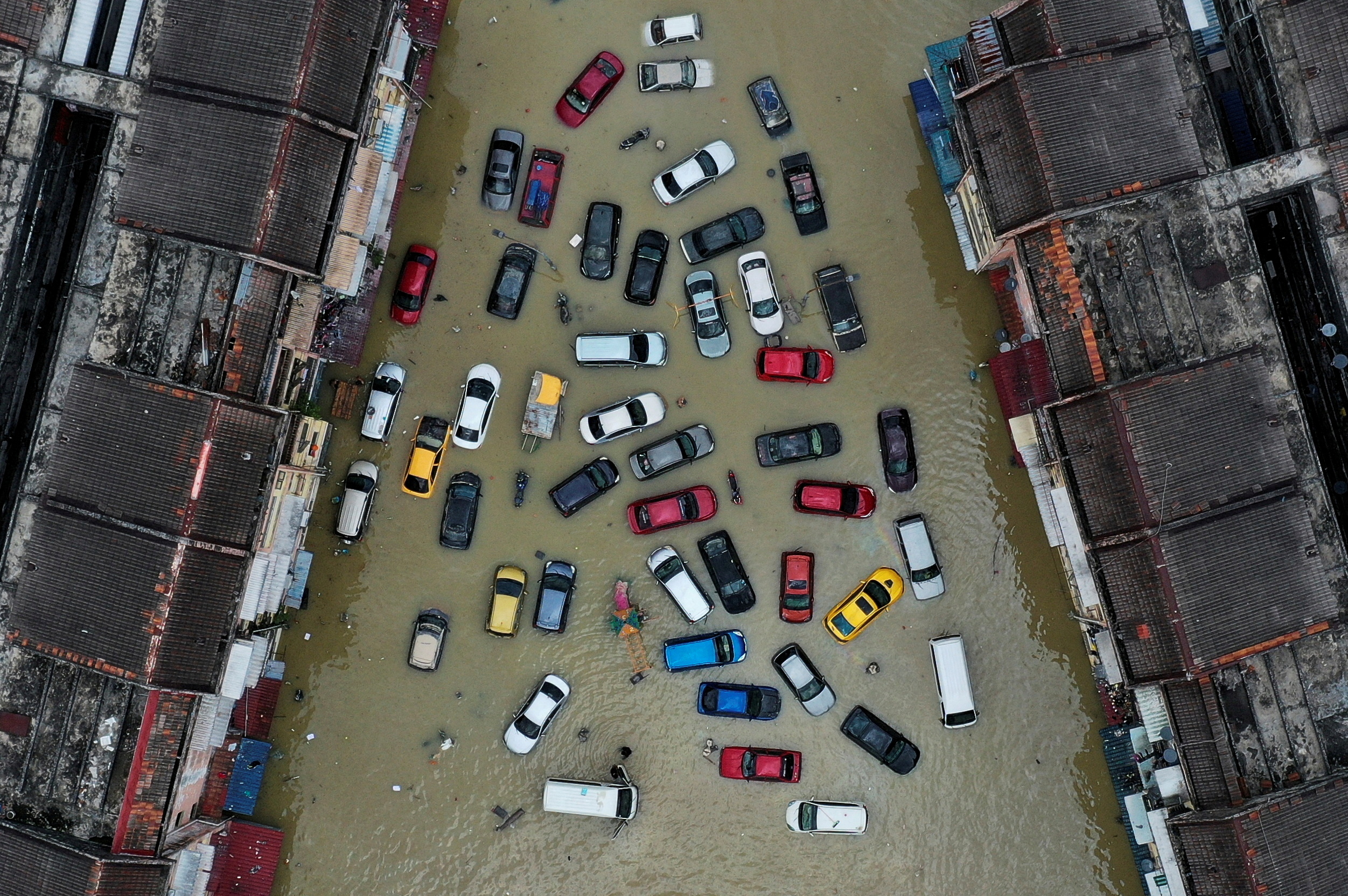 Aerial view shows vehicles submerged in flood waters in Shah Alam