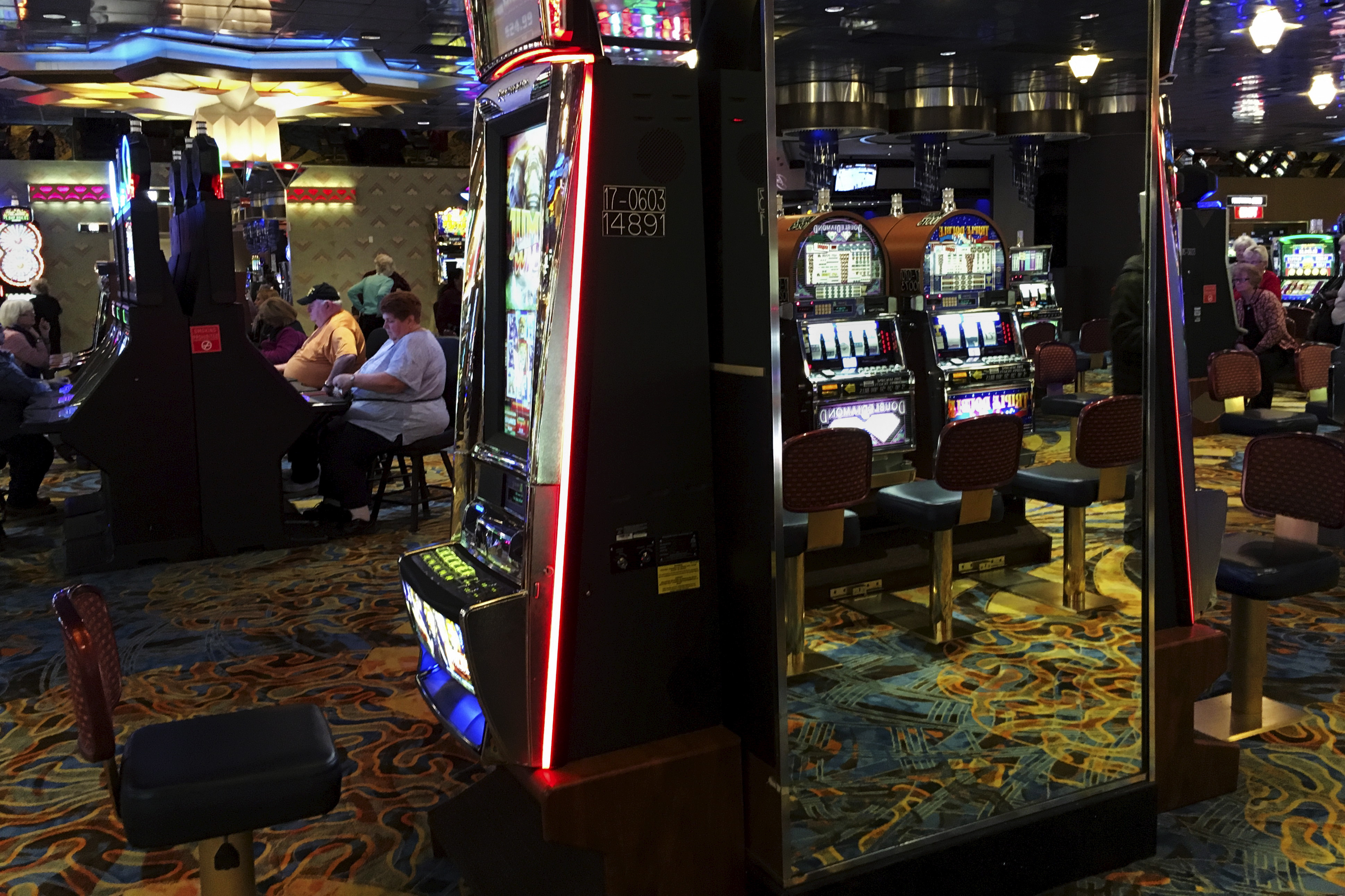 People play slot machines inside a casino in Atlantic City