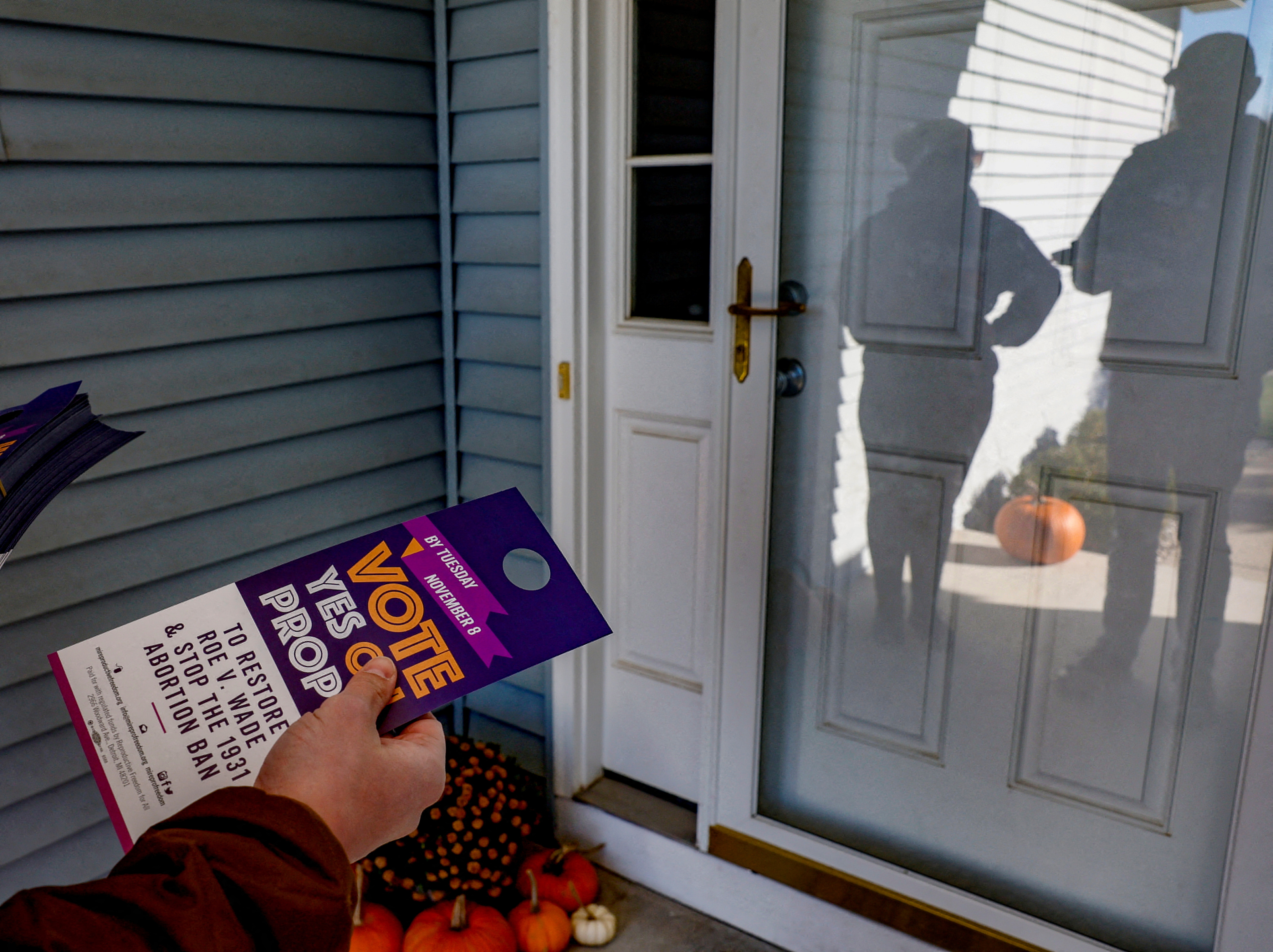 Canvassers in support of abortion rights knock on doors ahead of the midterm election in Michigan
