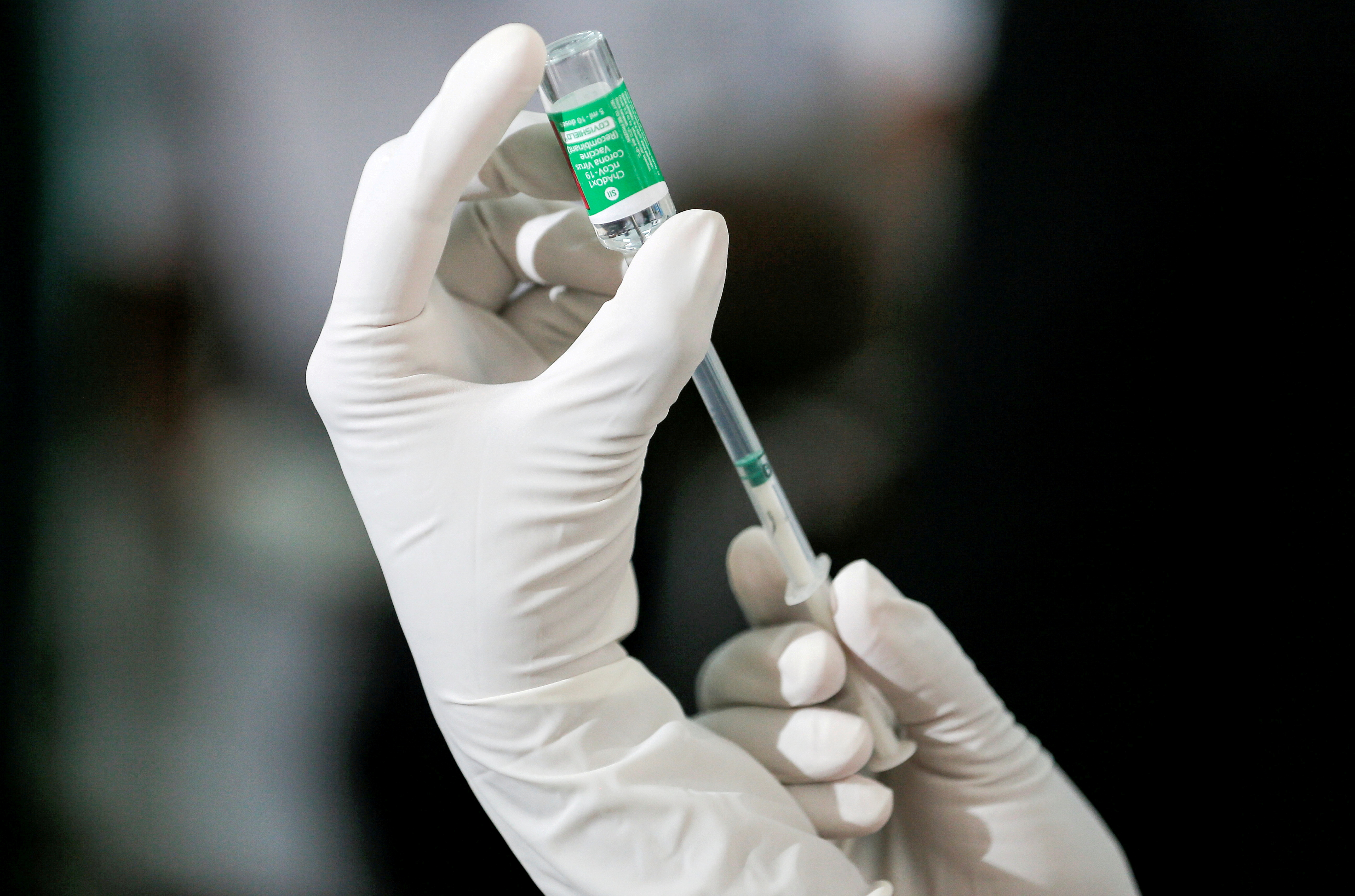 A health official draws a dose of the AstraZeneca's COVID-19 vaccine manufactured by the Serum Institute of India, at Infectious Diseases Hospital in Colombo