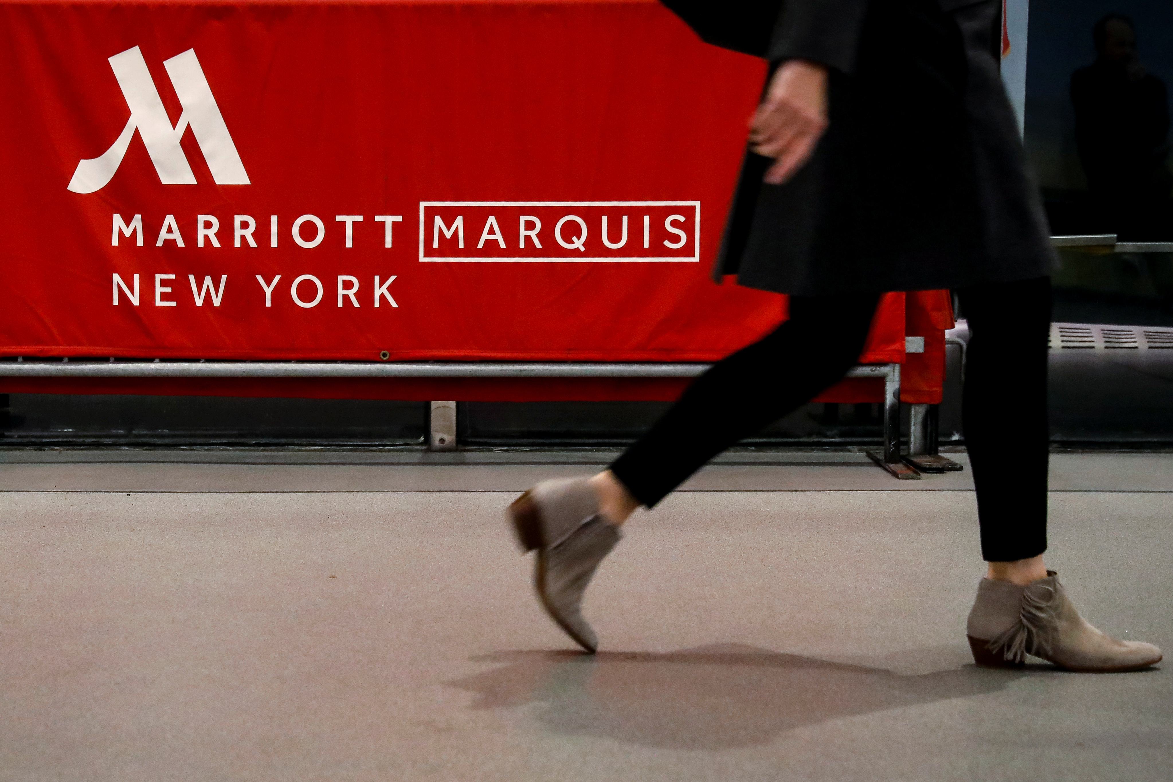 A guest arrives at the Marriott Marquis hotel in Times Square in New York