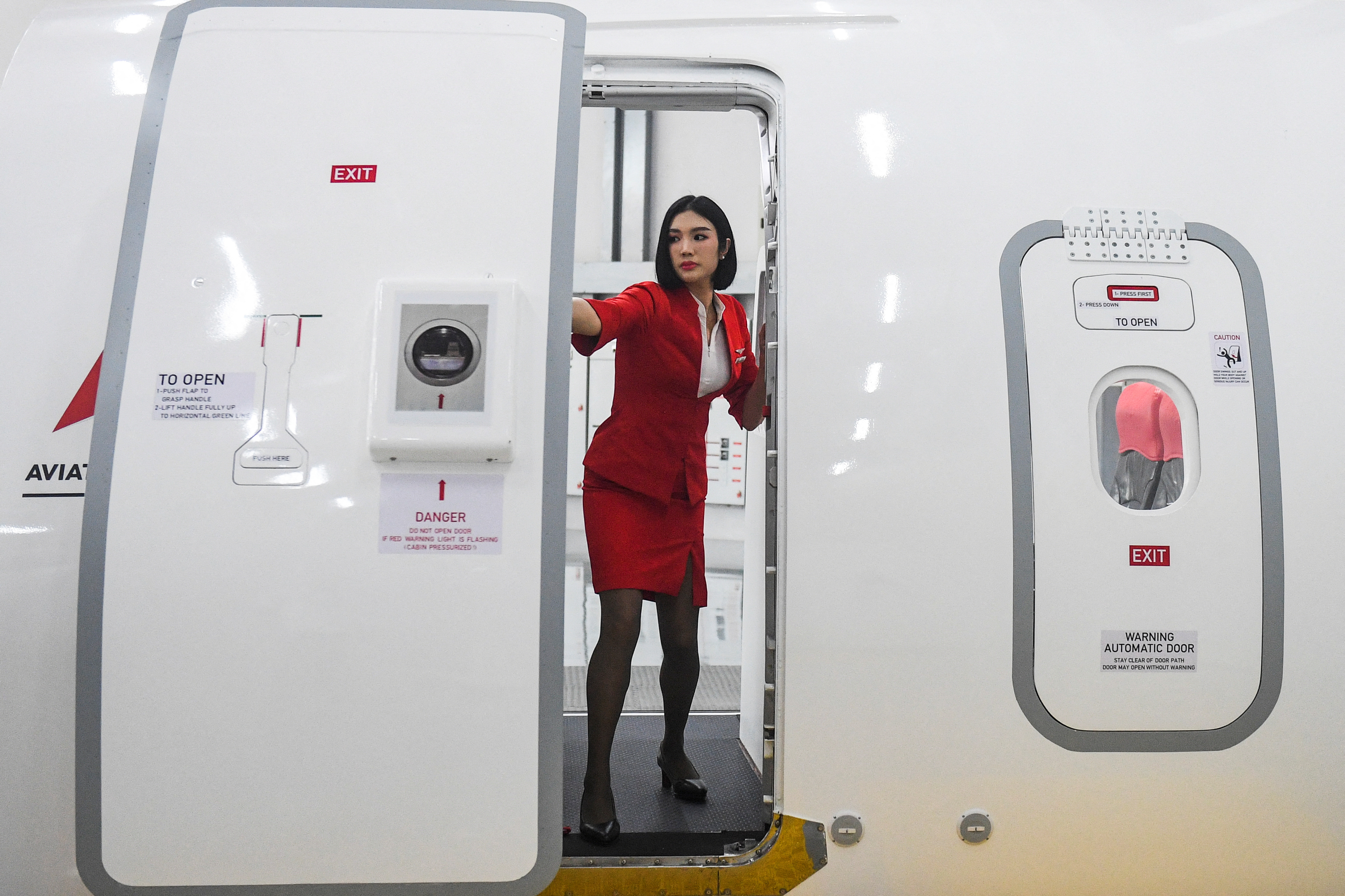 Thai AirAsia holds an annual safety & emergency course as China reopens its borders, in Bangkok