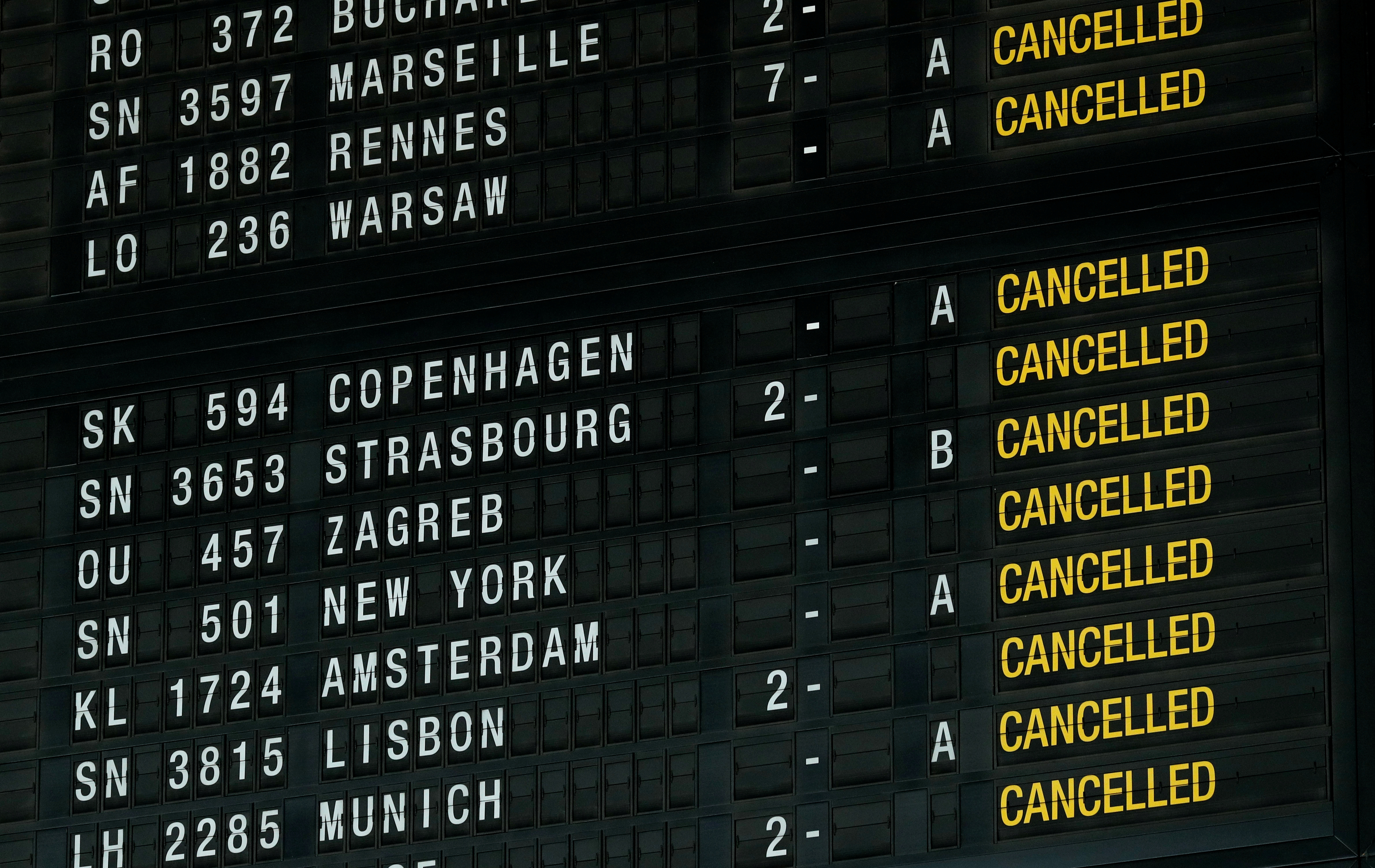 A flight information board displays cancelled flights during a strike at Zaventem international airport near Brussels