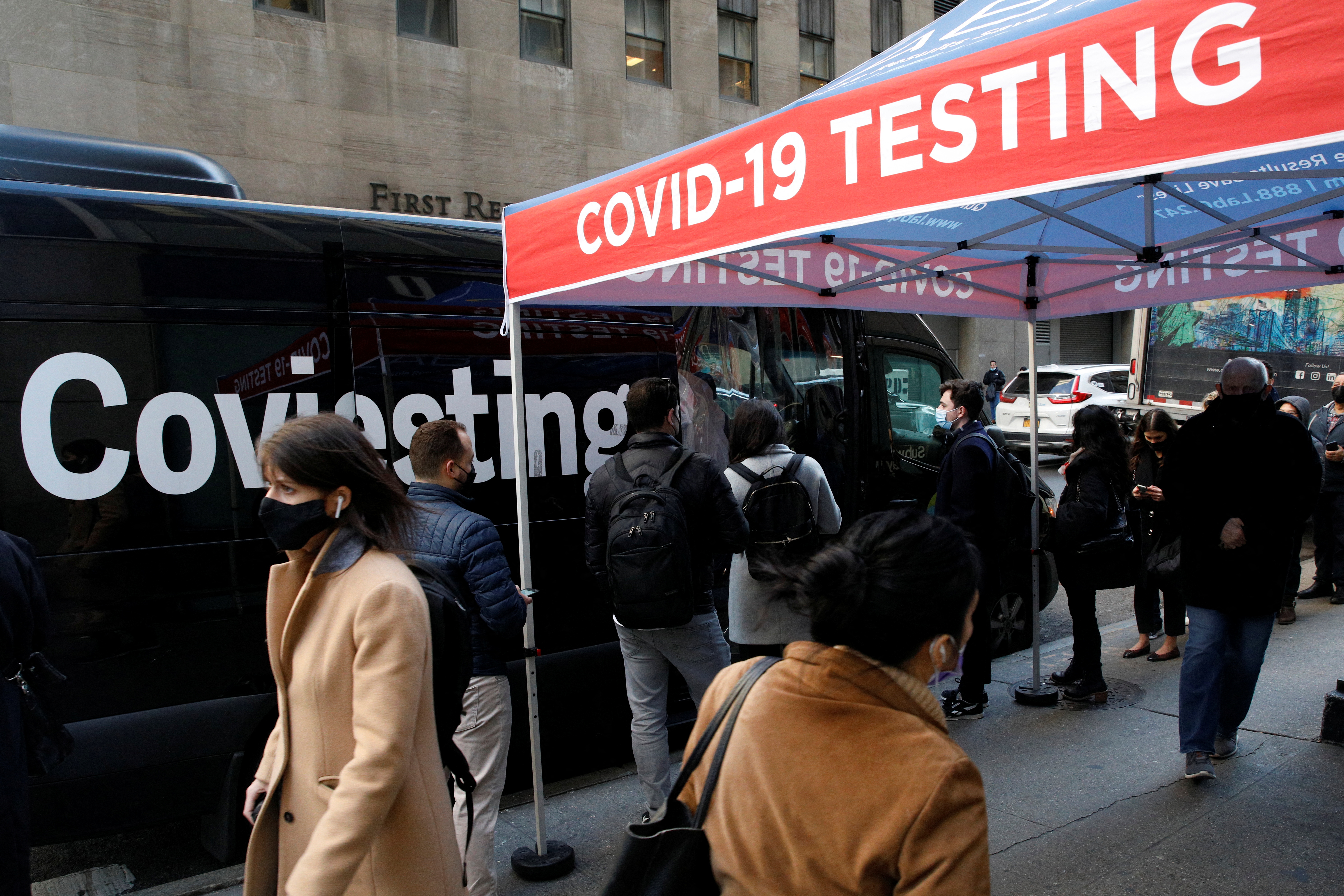 People wait in line to take coronavirus disease (COVID-19) tests at pop-up testing site in New York