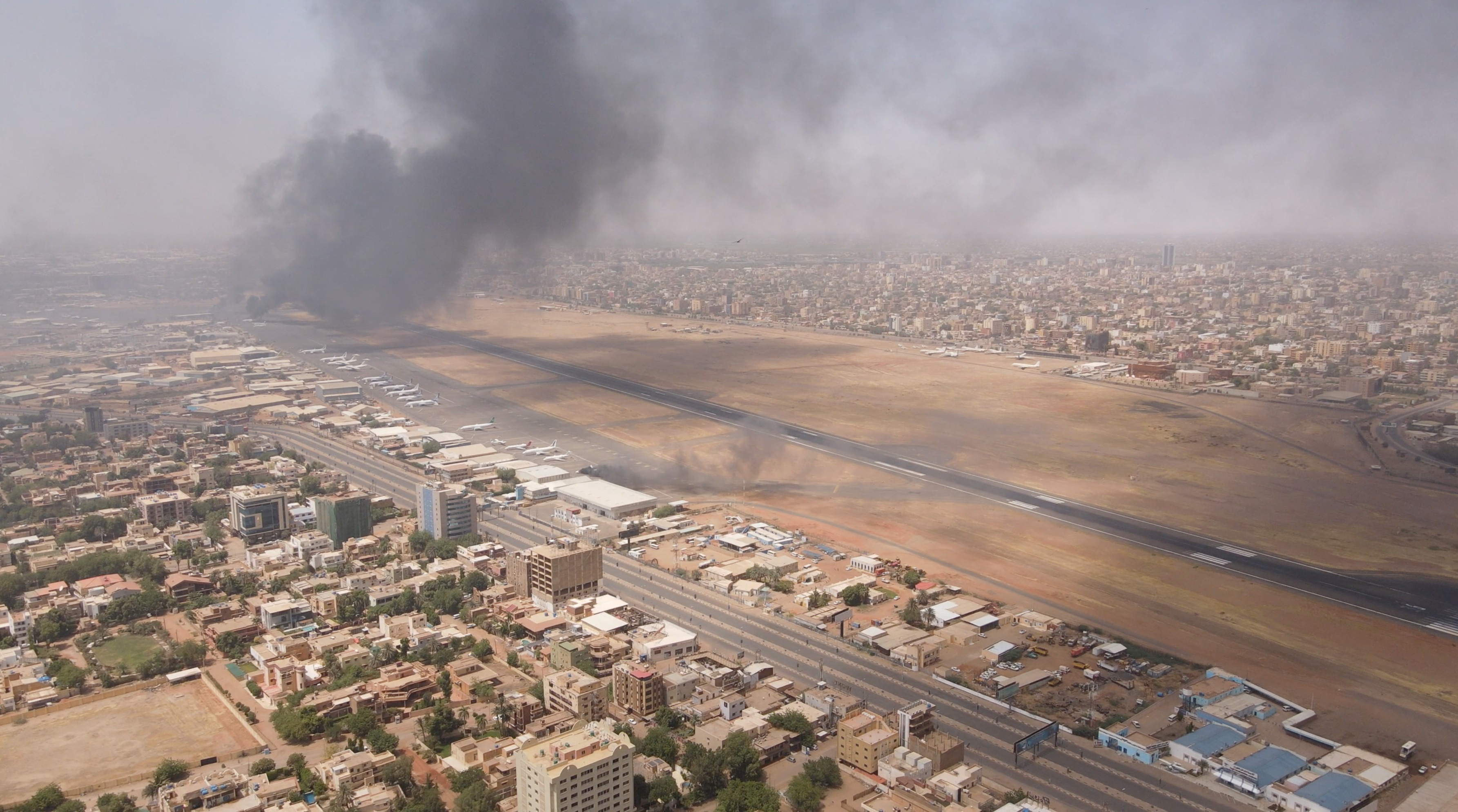 Smoke rises over the city as army and paramilitaries clash in power struggle, in Khartoum