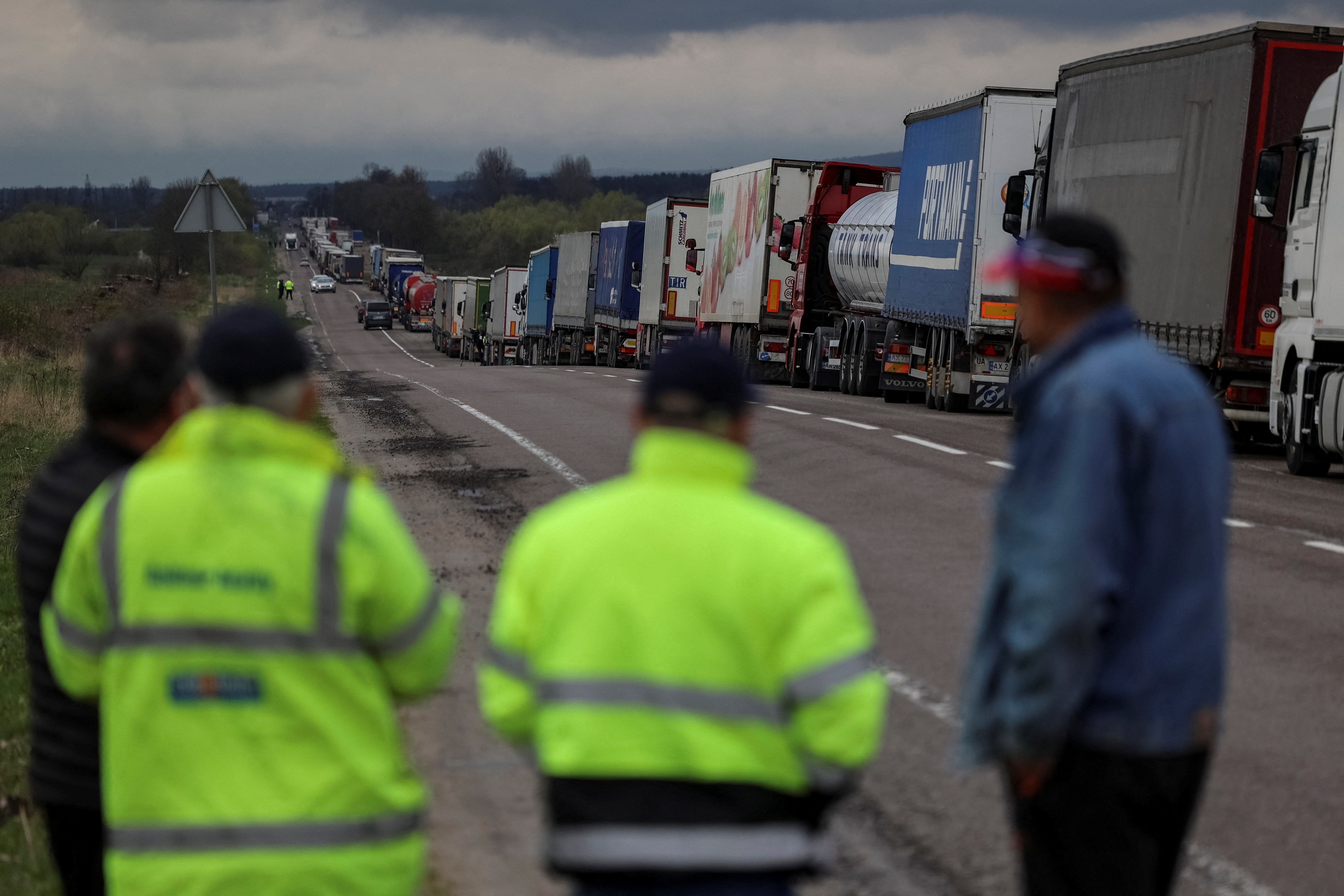 Trucks wait for crossing the Ukraine-Poland border at the checkpoint Rava-Ruska