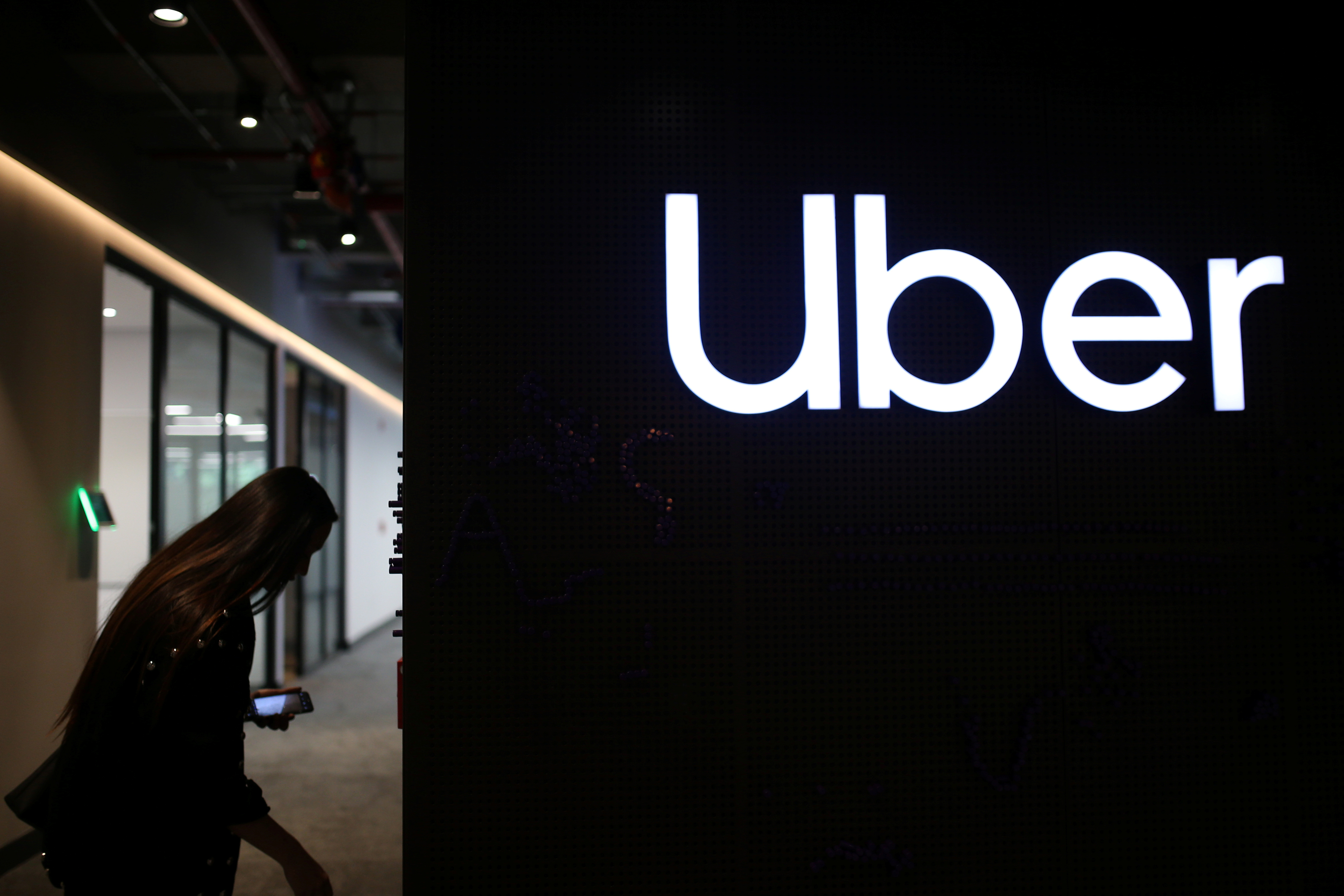 Uber's logo is pictured at its office in Bogota