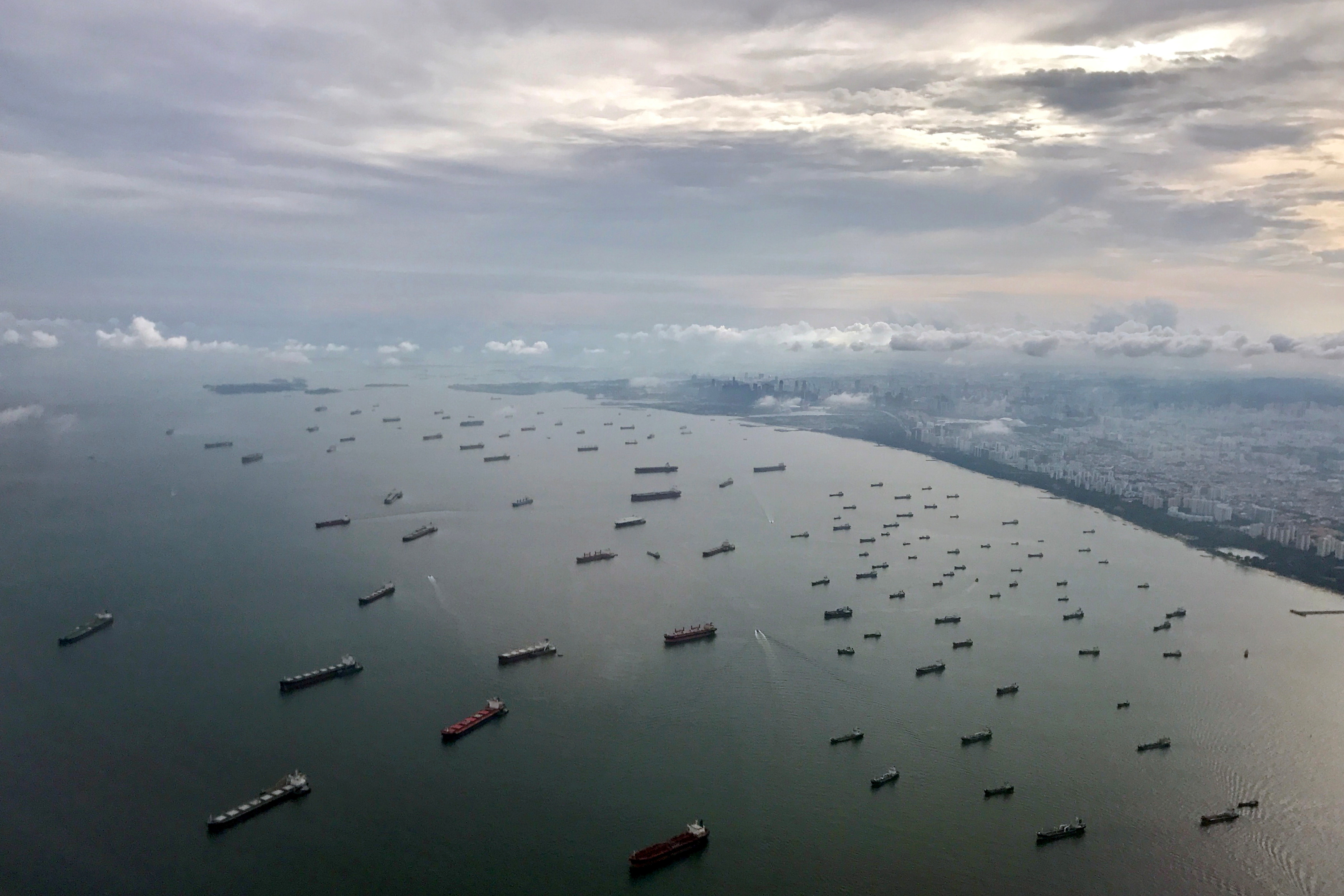 A bird's-eye view of ships along the coast in Singapore