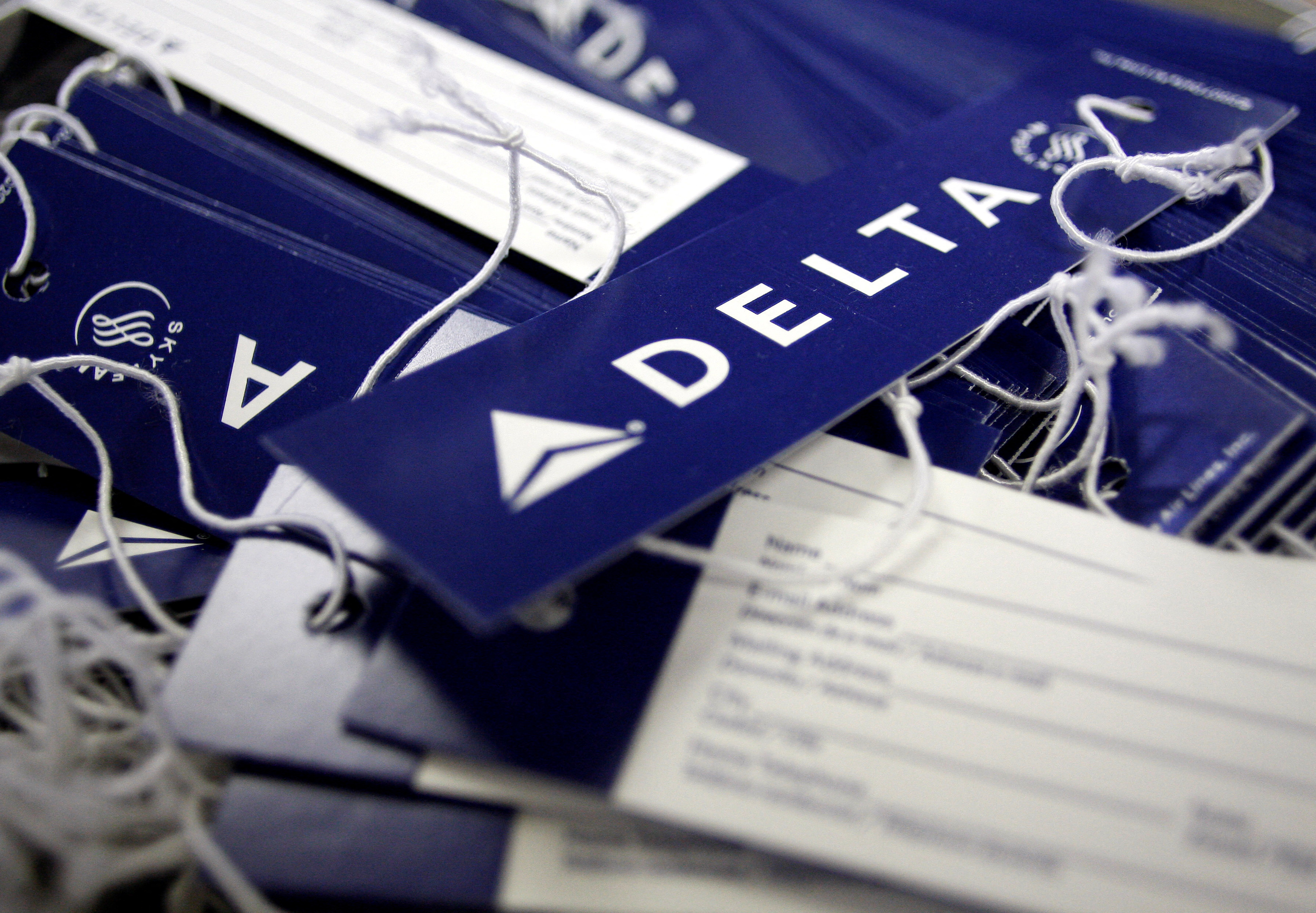 Delta airline name tags are seen at Delta terminal in JFK Airport in New York