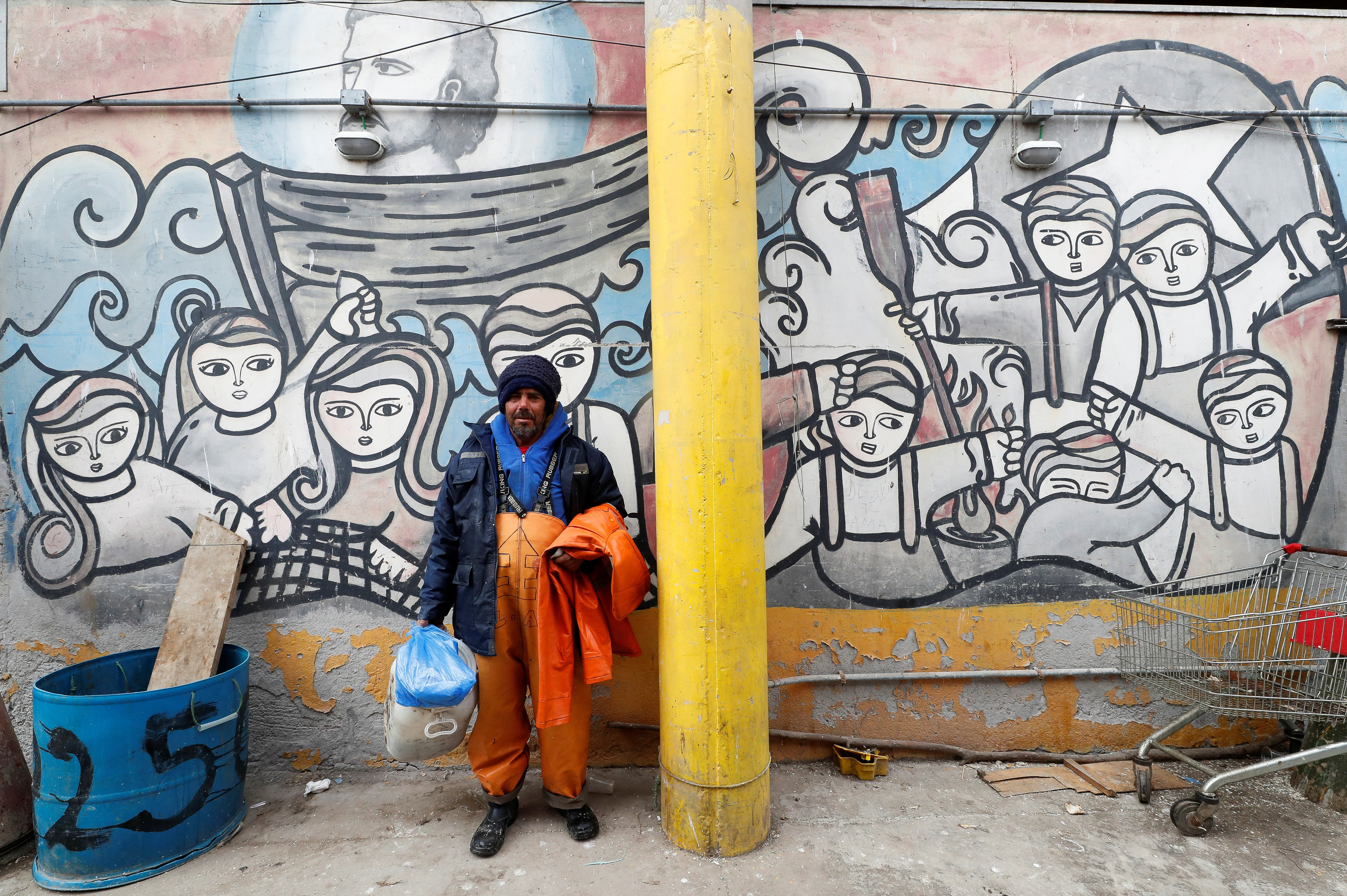 An artisanal fisher is seen after arriving at a fishermen's cove in Valparaiso,