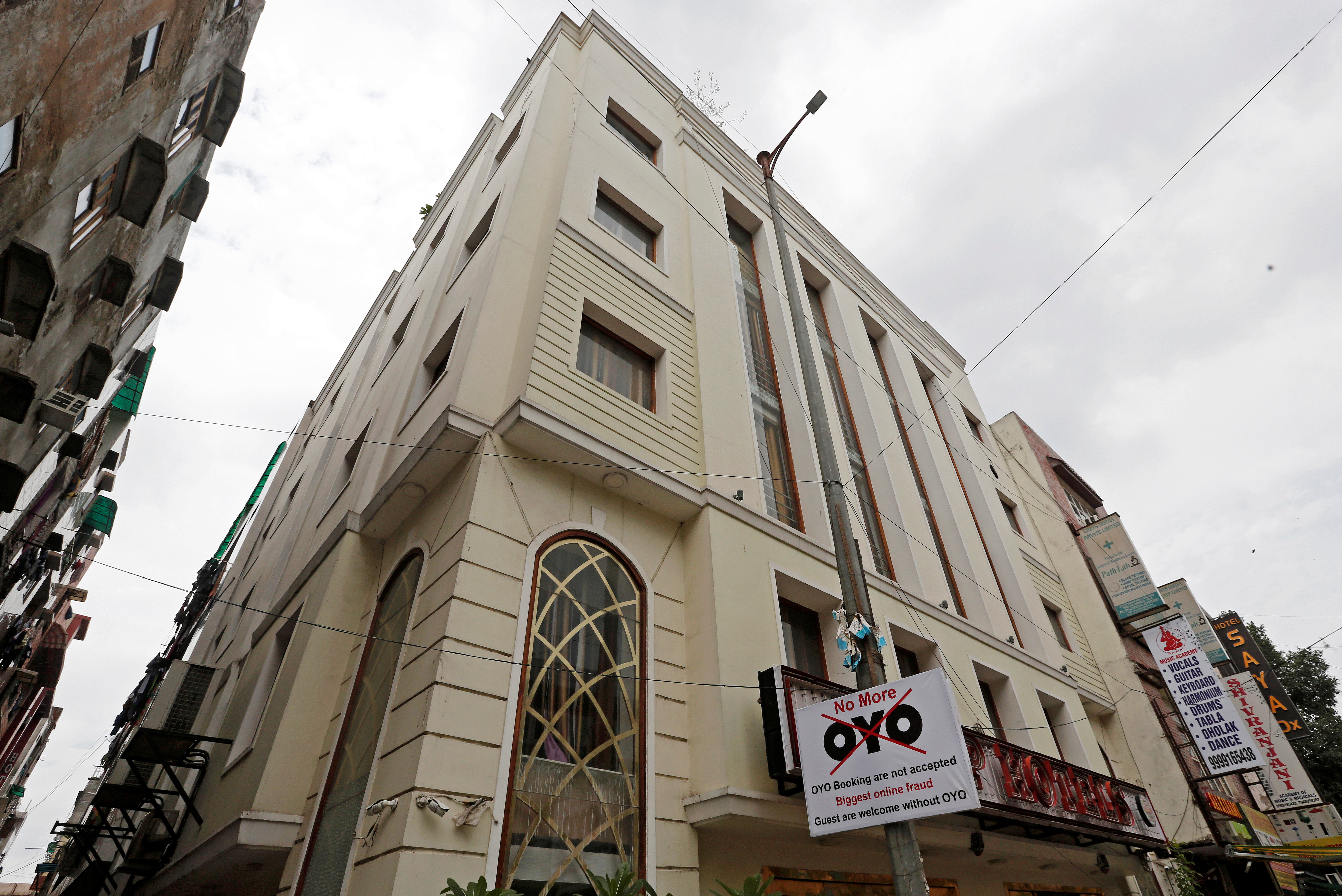 A sign against Oyo is seen outside a hotel in New Delhi