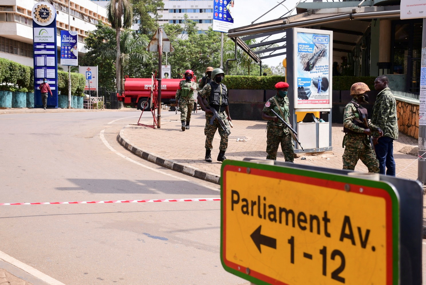 Ugandan security forces arrive to secure the scene of a blast in Kampala