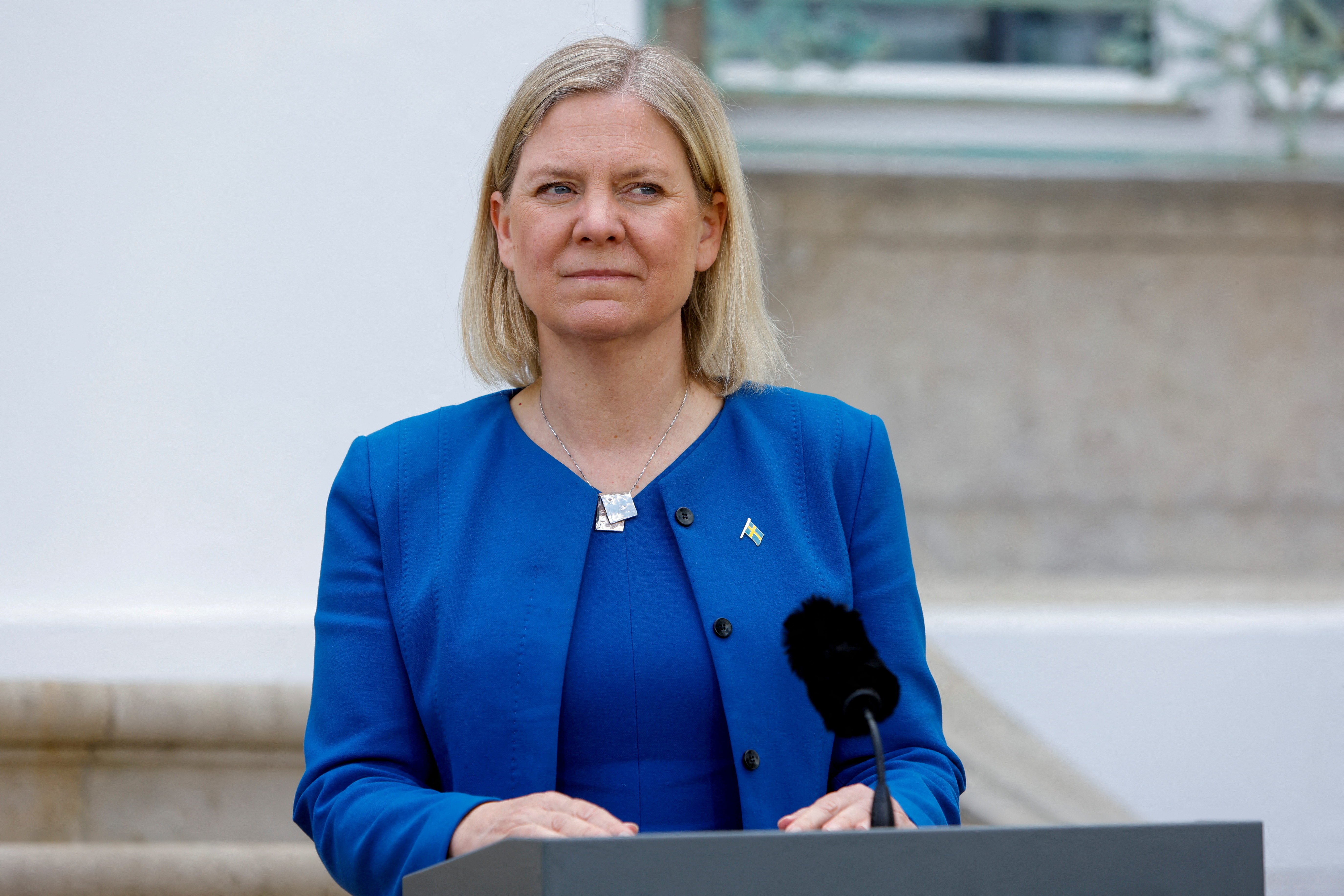 FILE PHOTO: Swedish Prime Minister Magdalena Andersson looks on next to a microphone on the first day of a special German cabinet meeting hosted by Chancellor Olaf Scholz at the government's guest house Schloss Meseberg in Meseberg, Gransee, Ge