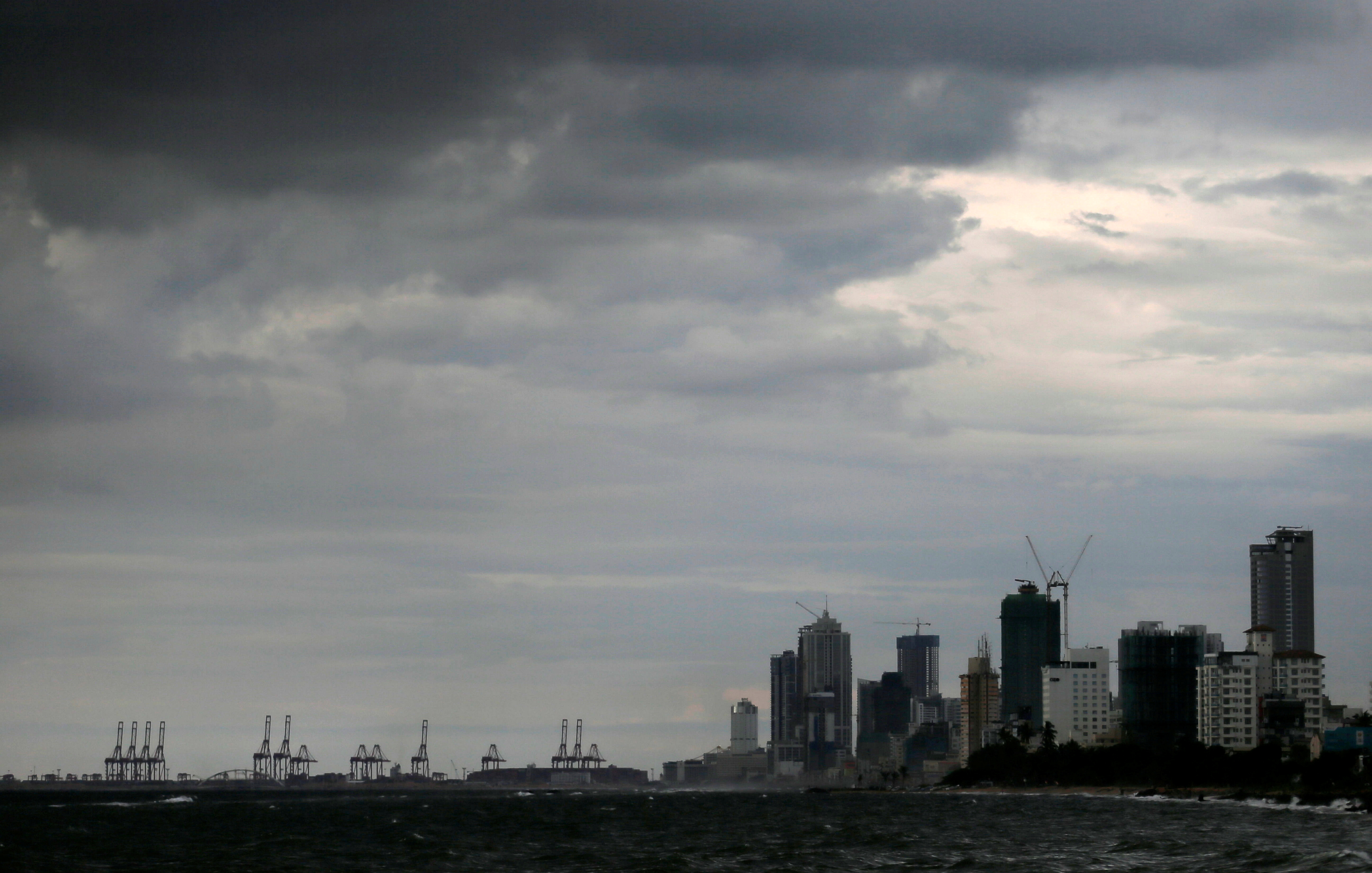 A general view of the main business district as rain clouds gather above in Colombo